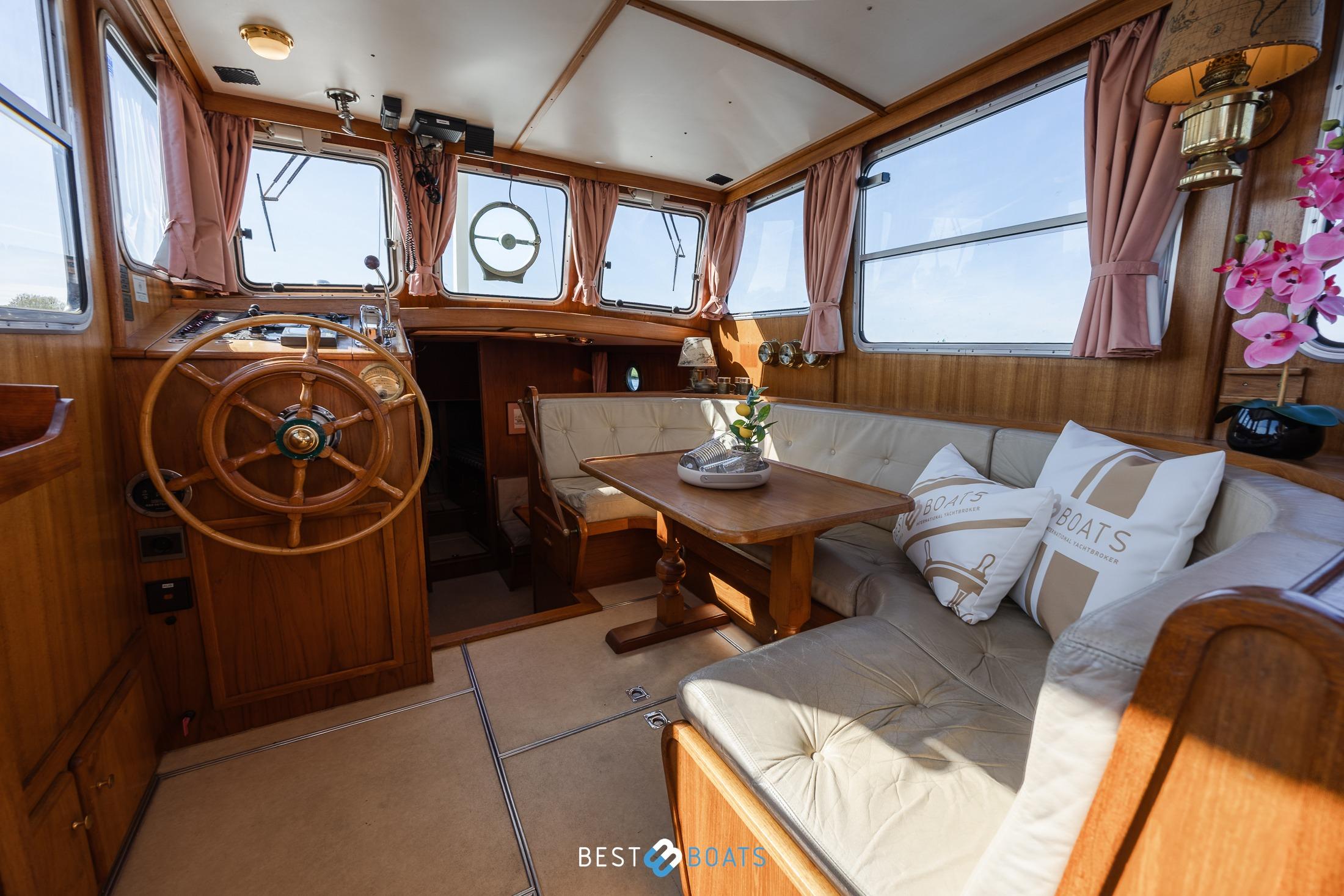 Luxurious interior of 1986 Linssen St. Jozef 1050 Salon AK-L yacht with wooden accents.