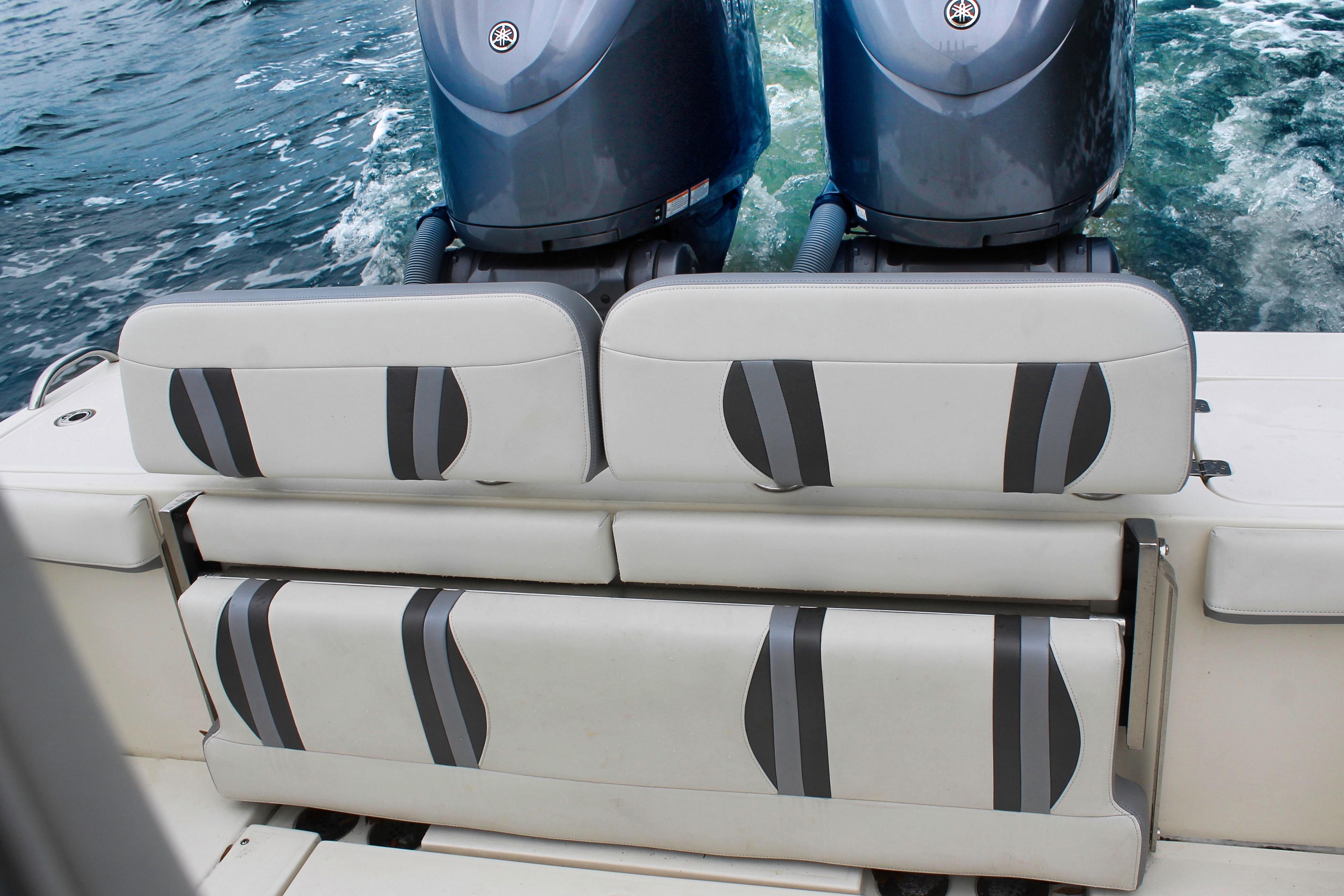 2024 ShearWater 270 SS Open Carolina boat with dual engines and cushioned seating.