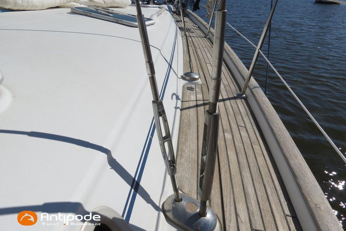 Deck view of a 2003 Beneteau Oceanis 411 yacht with wooden details.