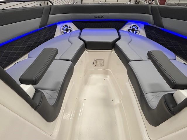 2026 Chaparral SSX 6 boat interior with blue LED lighting and cushioned seating.