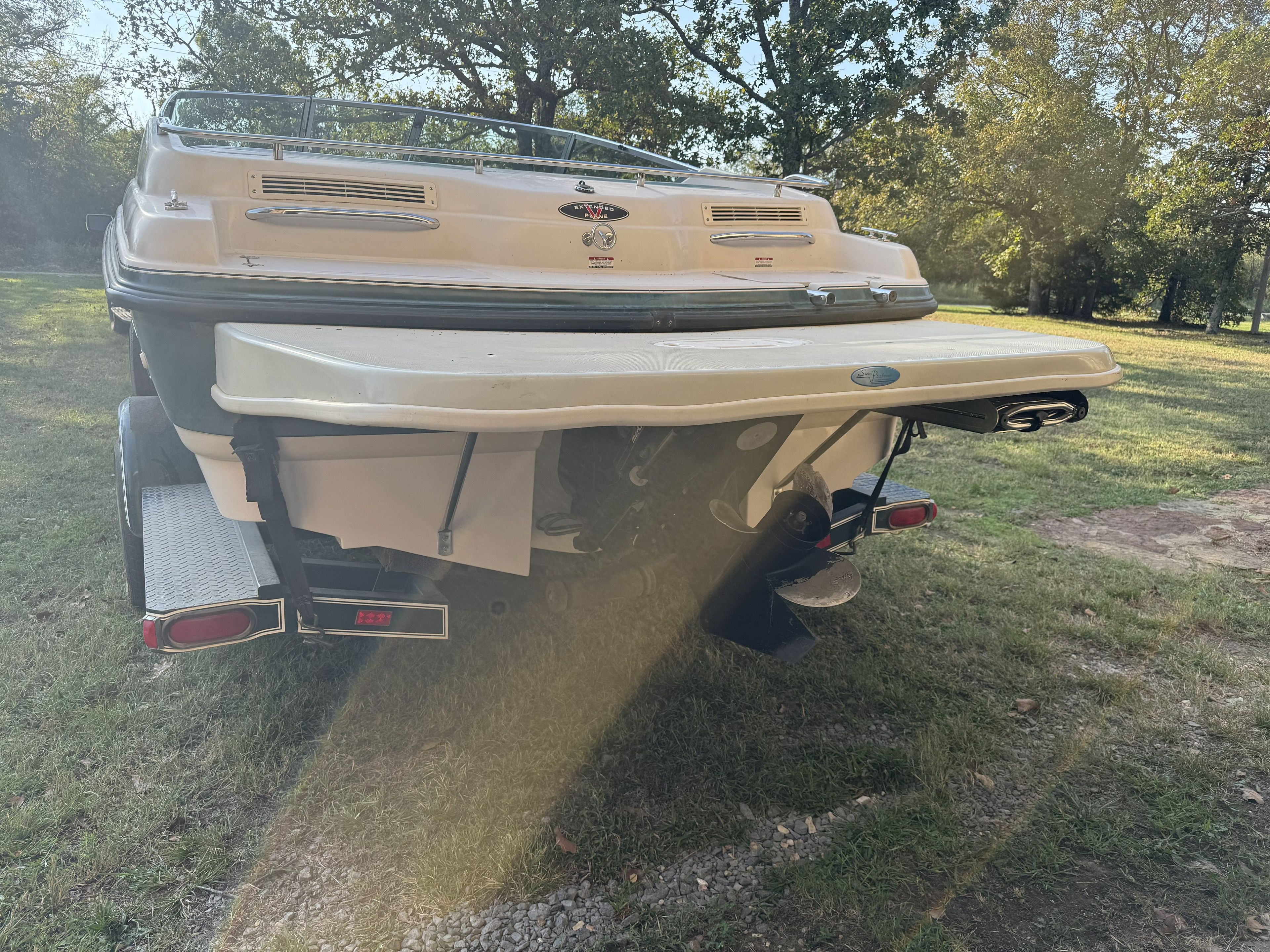 The image shows the rear of a 1996 Chaparral 1830 SS boat on a trailer.