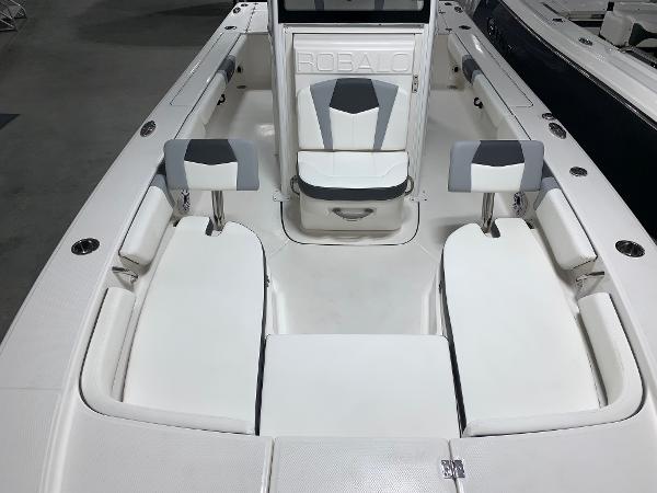 2024 Robalo 246 Cayman boat interior with white and gray seating.