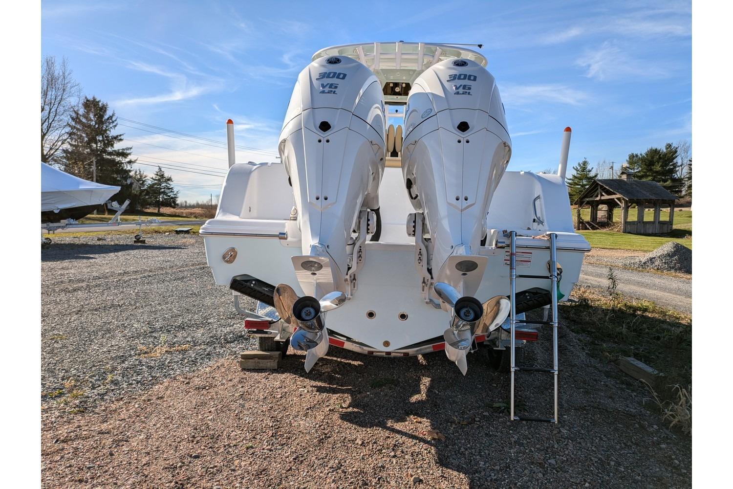2025 Sportsman Open 282 Center Console with twin 300 V6 engines, rear view.