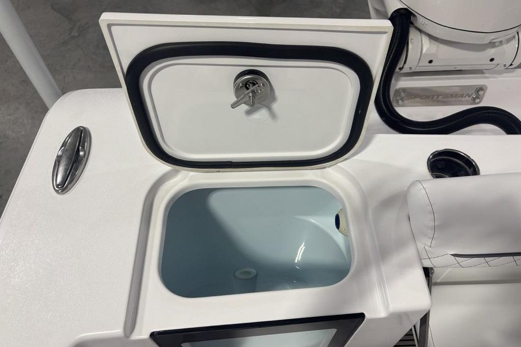 2026 Sportsman Open 252 Center Console boat with open storage compartment.