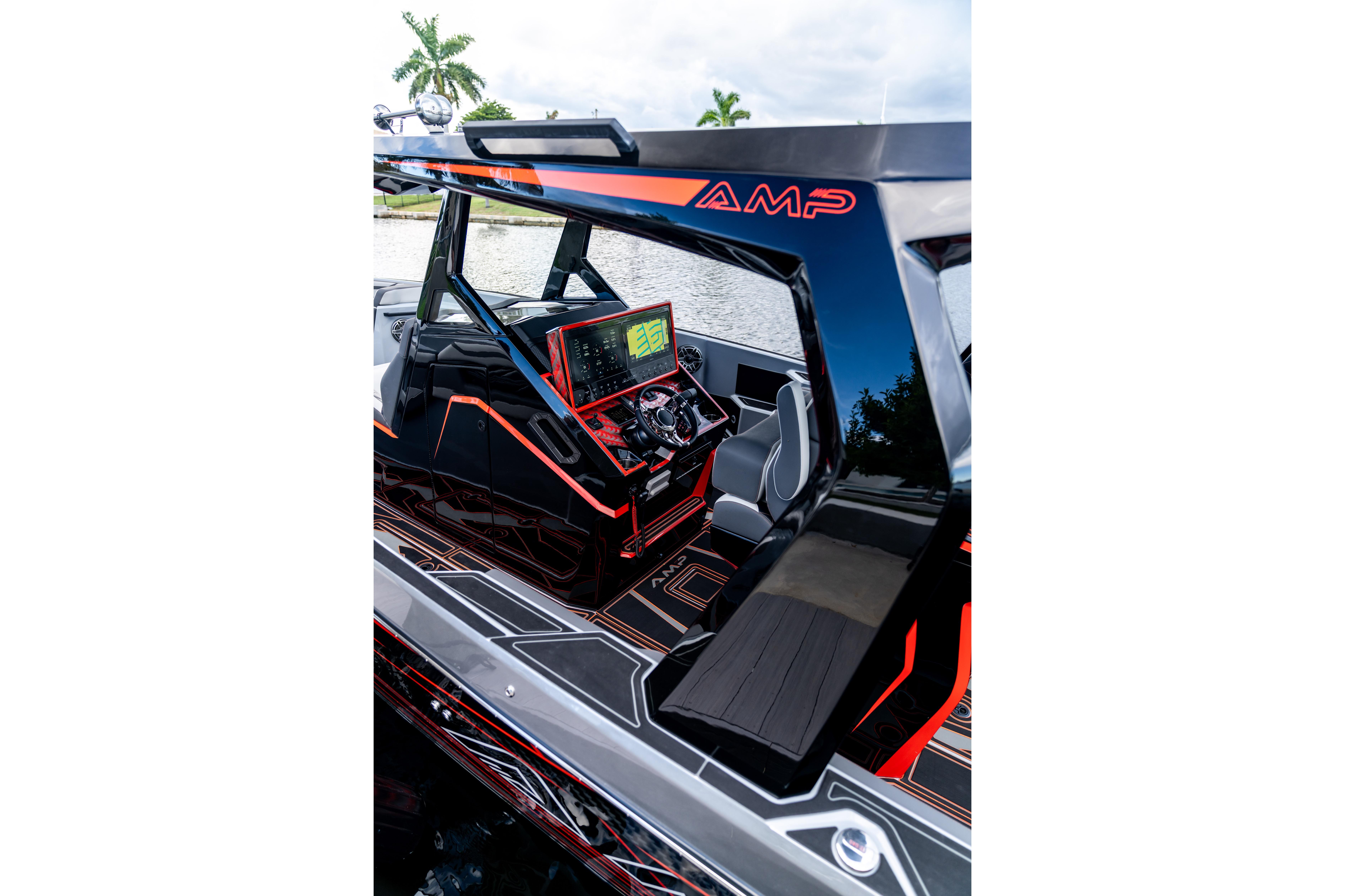 Futuristic AMP 333 boat interior with advanced dashboard, sleek design, and modern seating, 2026 model.