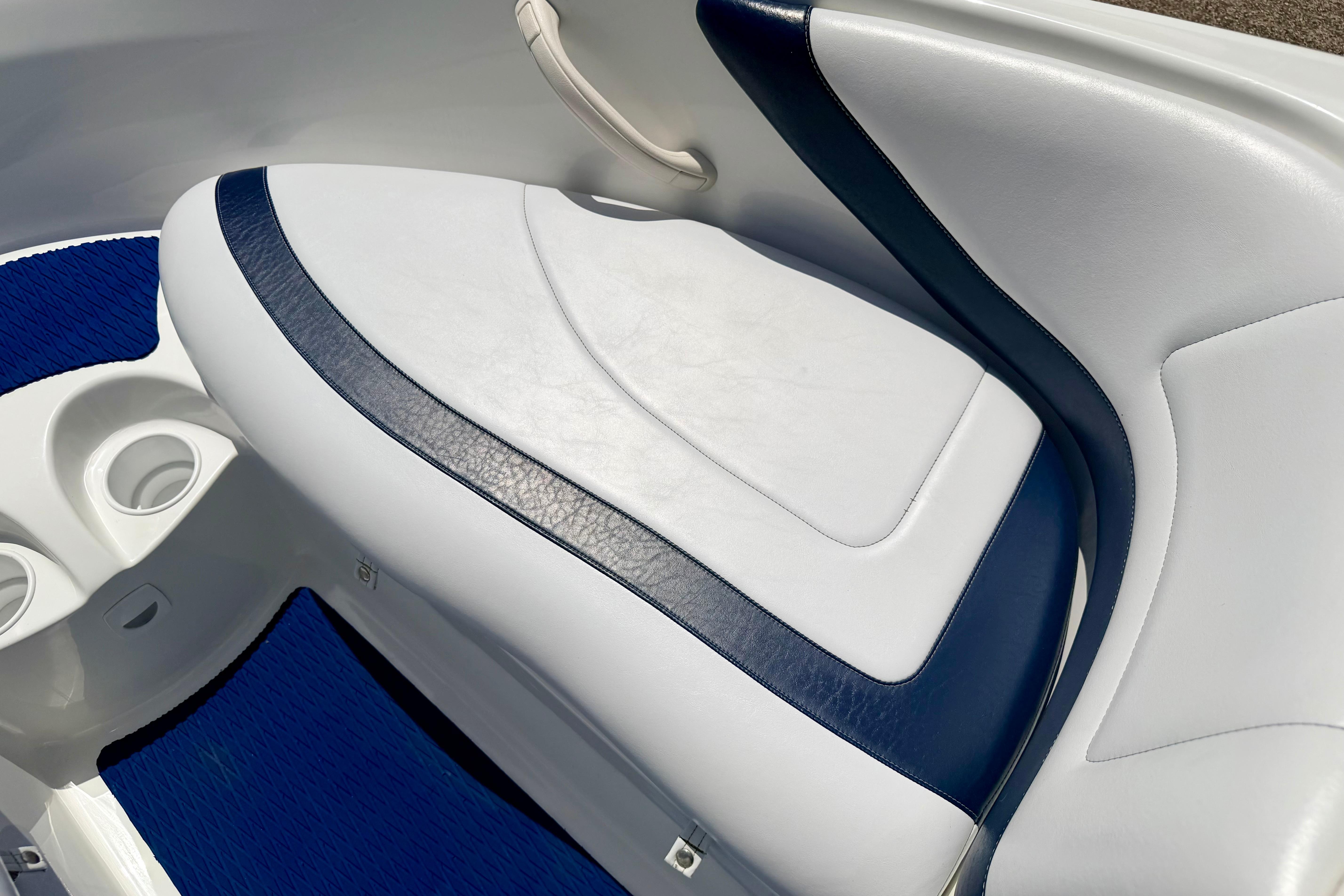 2004 Bombardier SEADOO Utopia 185 boat interior with white and blue seating.