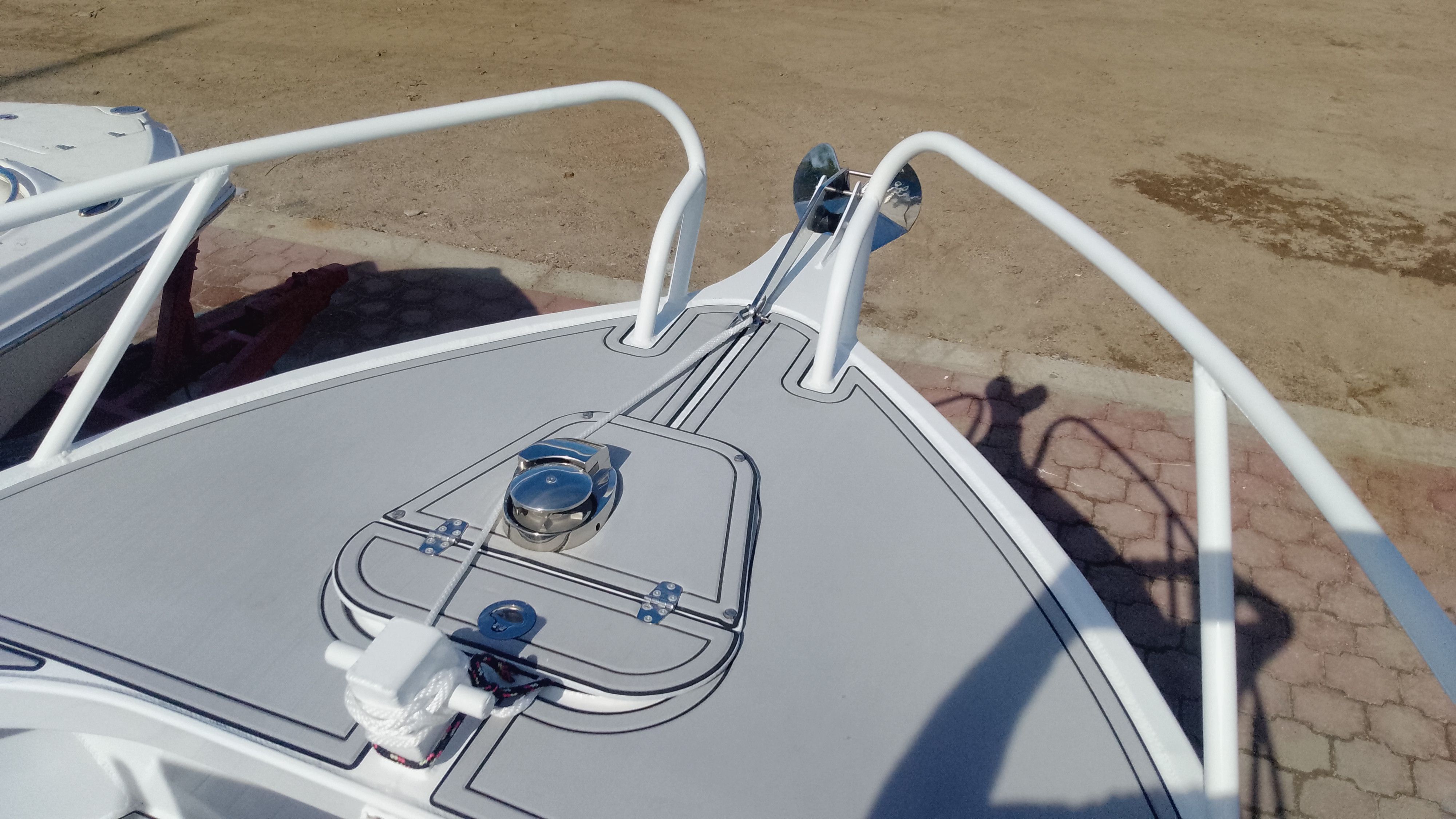 Bow of a 2024 Gospel Boat 7.5M on dry land.