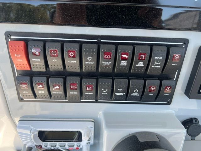 Control panel with various switches and a radio.