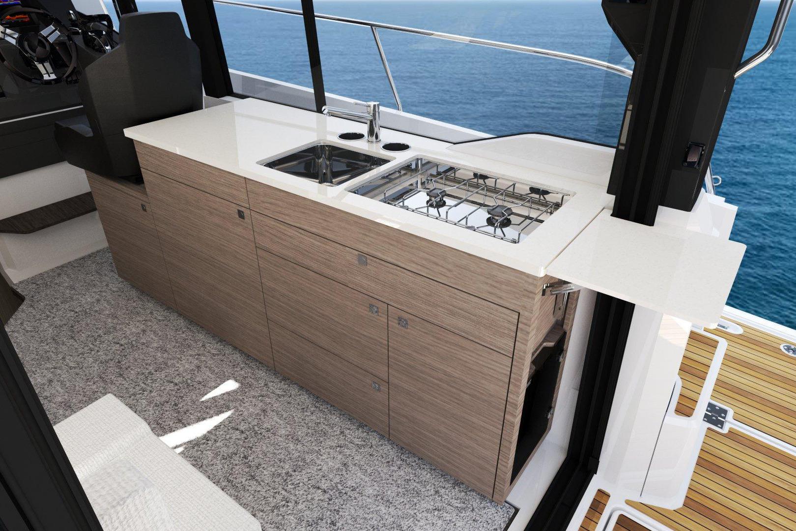 Manufacturer Provided Image: 2026 Jeanneau NC 1095 Coupe Series 2 interior kitchen with ocean view.