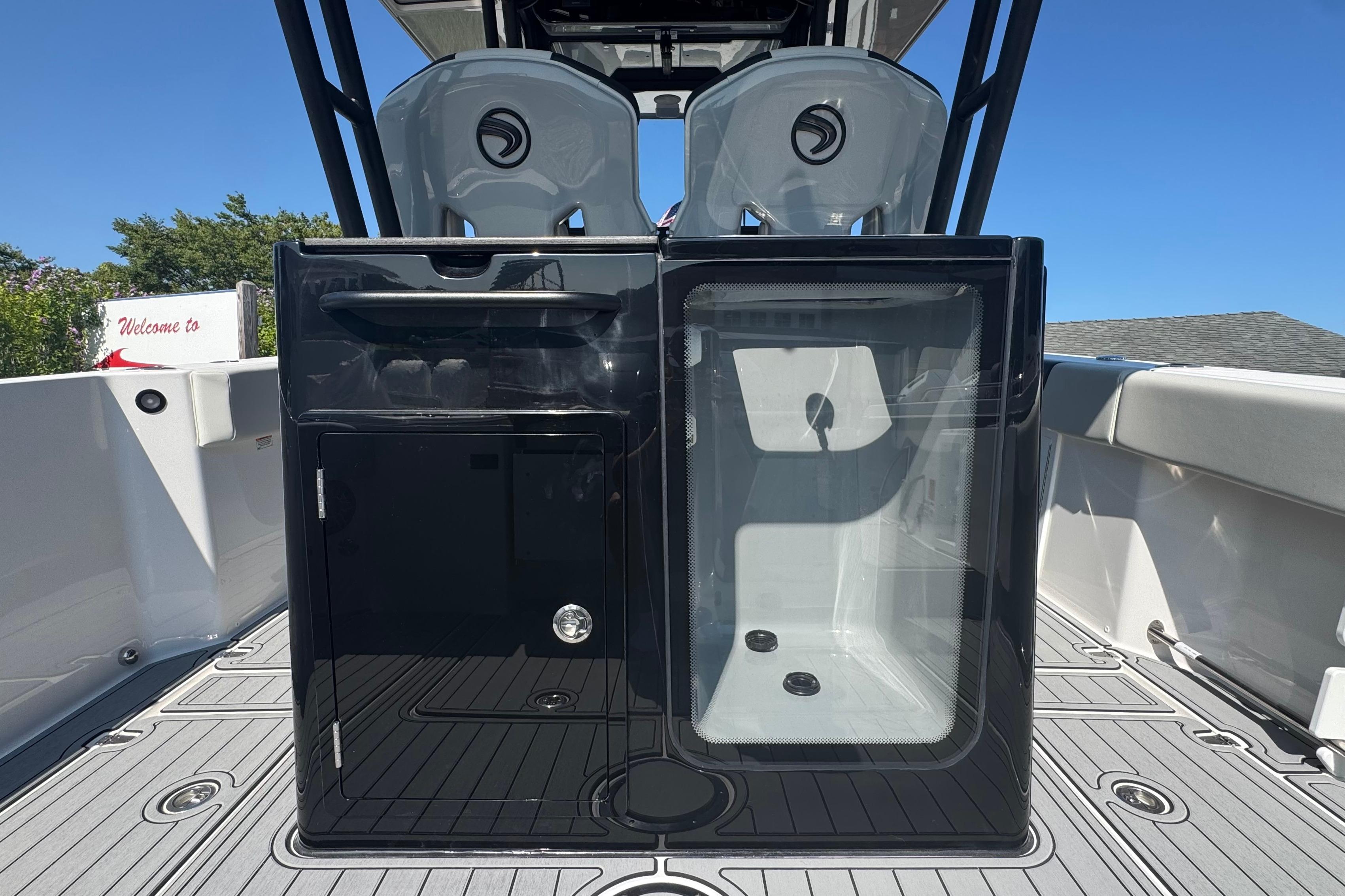 2025 Edgewater 340CC boat interior with sleek black cabinetry and seating.