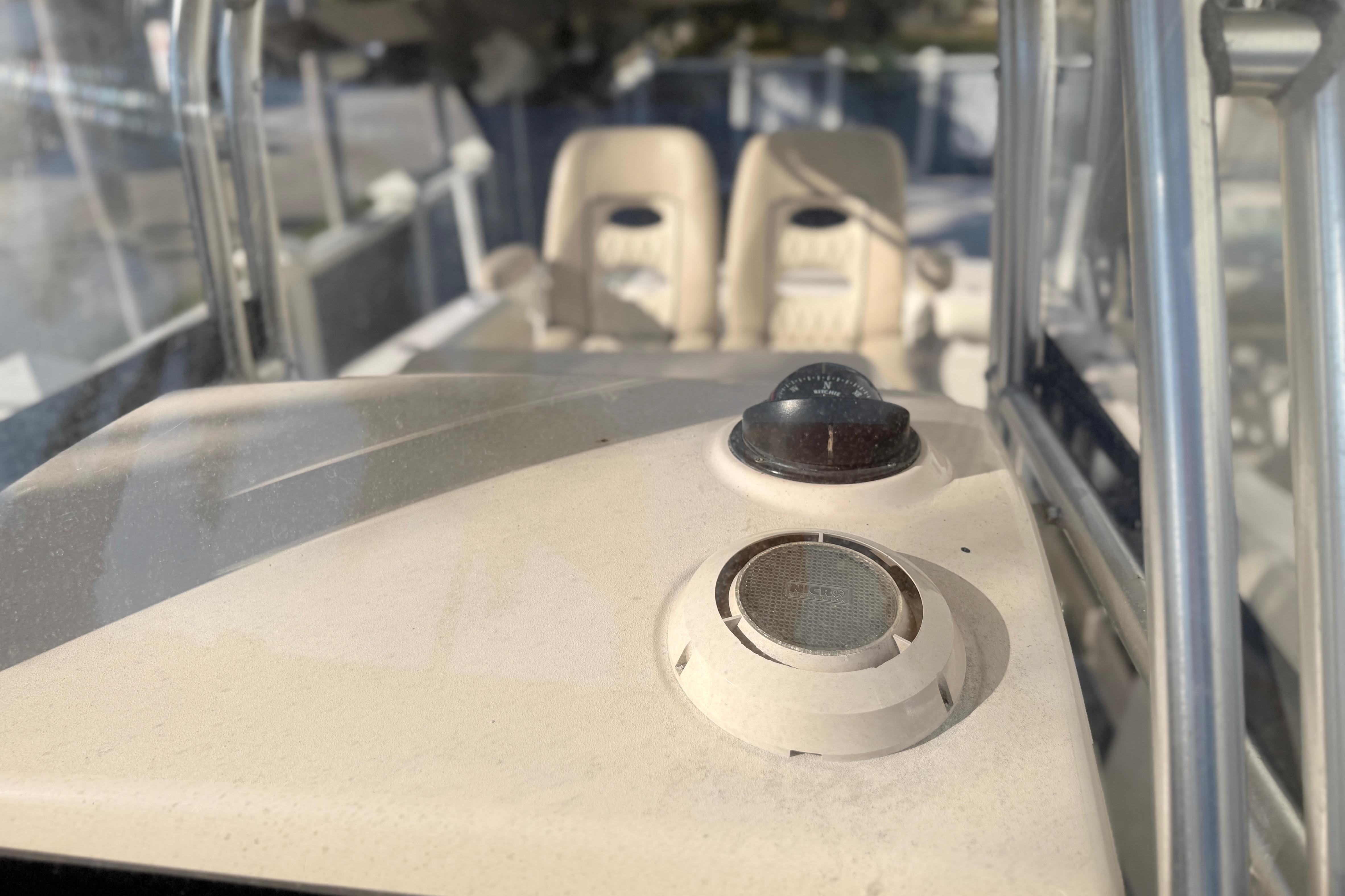 2004 Grady White 273 boat interior with compass and speaker detail.