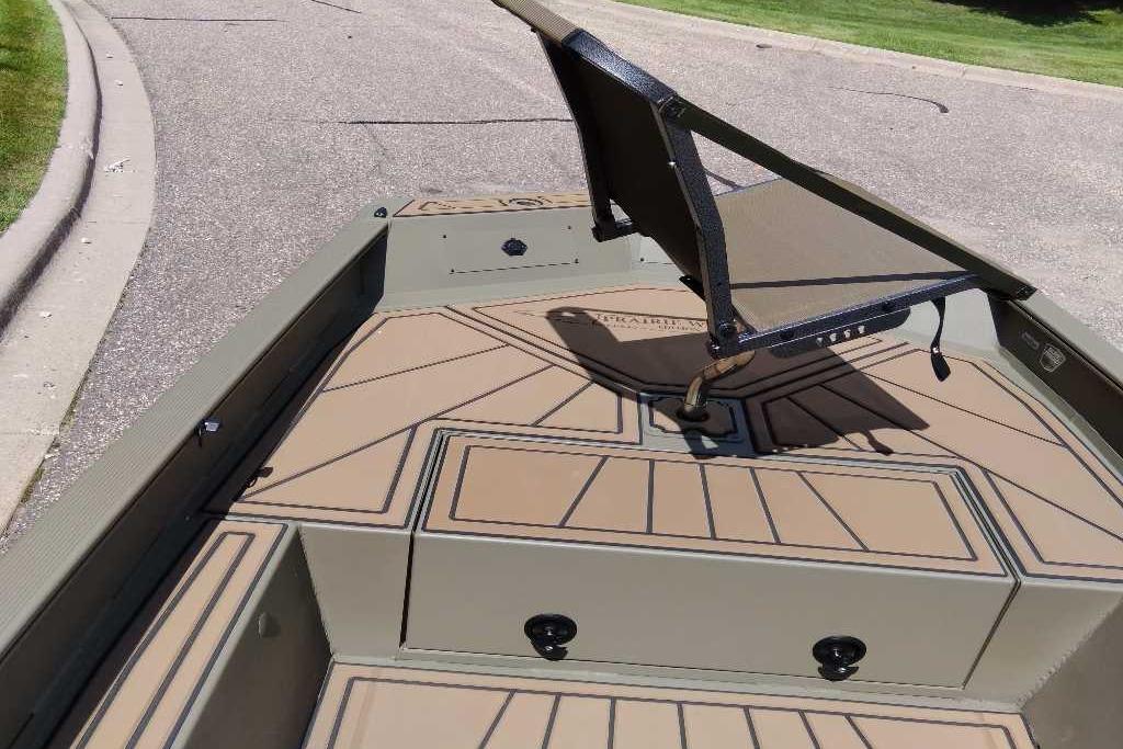 2026 Tracker Grizzly 1650 T Prairie Wings Edition boat with seating on deck.