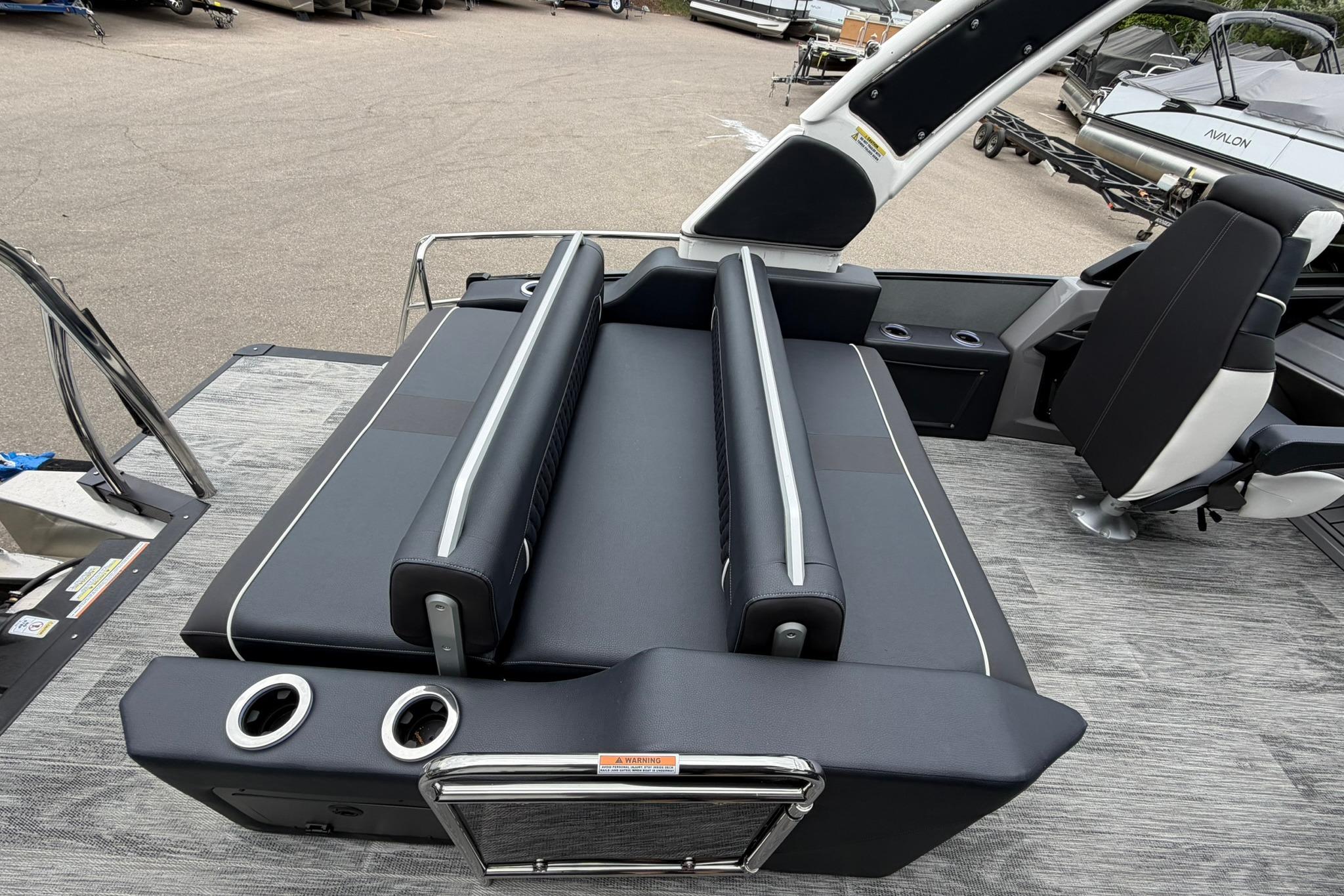 2026 Avalon Excalibur LTD Flex Lounge boat interior with sleek seating and modern design.