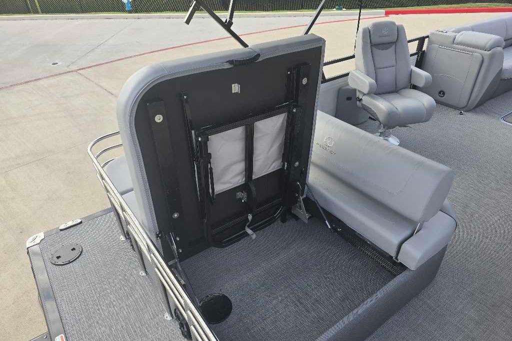 2025 Regency 250 LE3 Sport boat interior with gray seating and storage area.