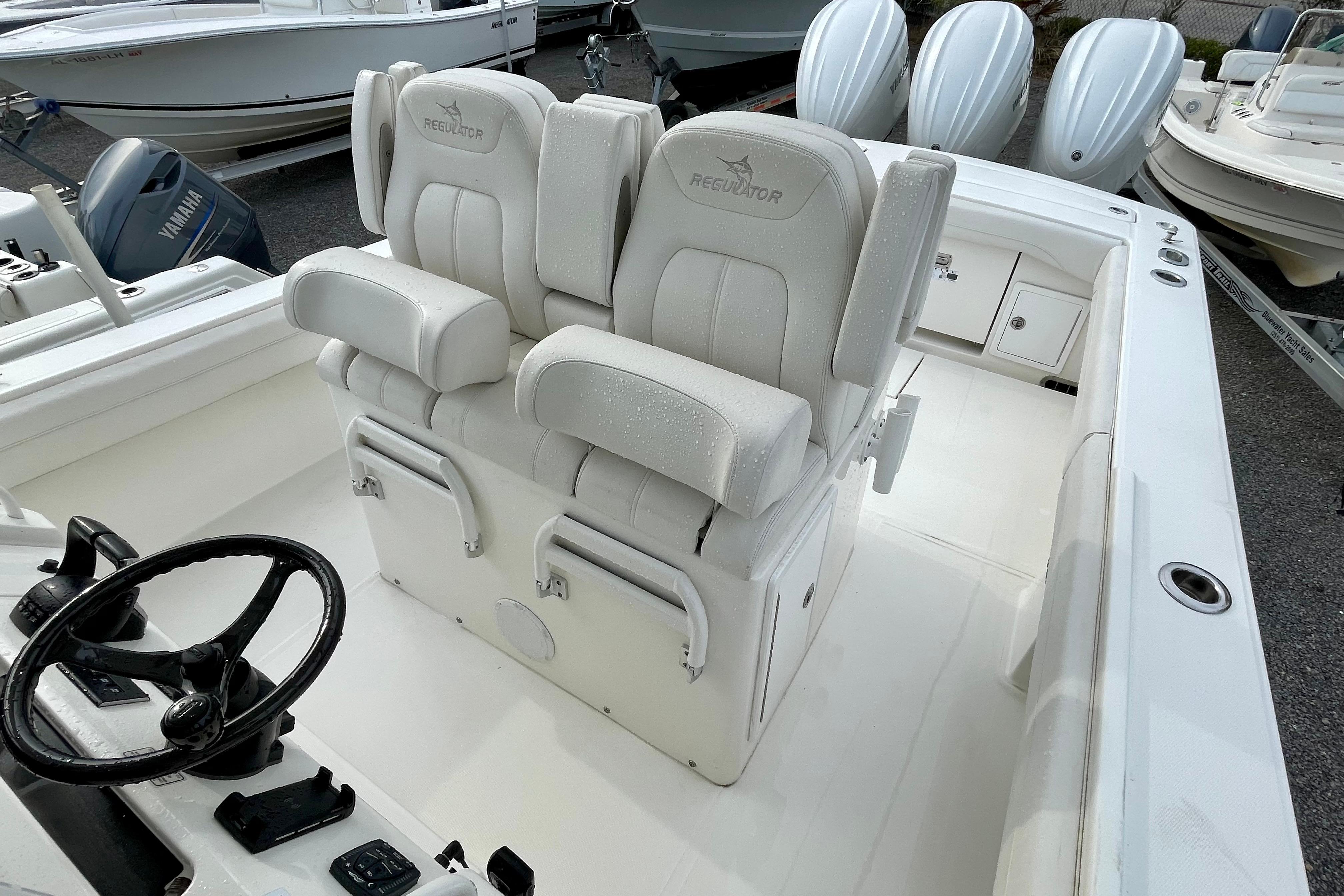 2023 Regulator 34 boat interior with dual helm seats and steering wheel.