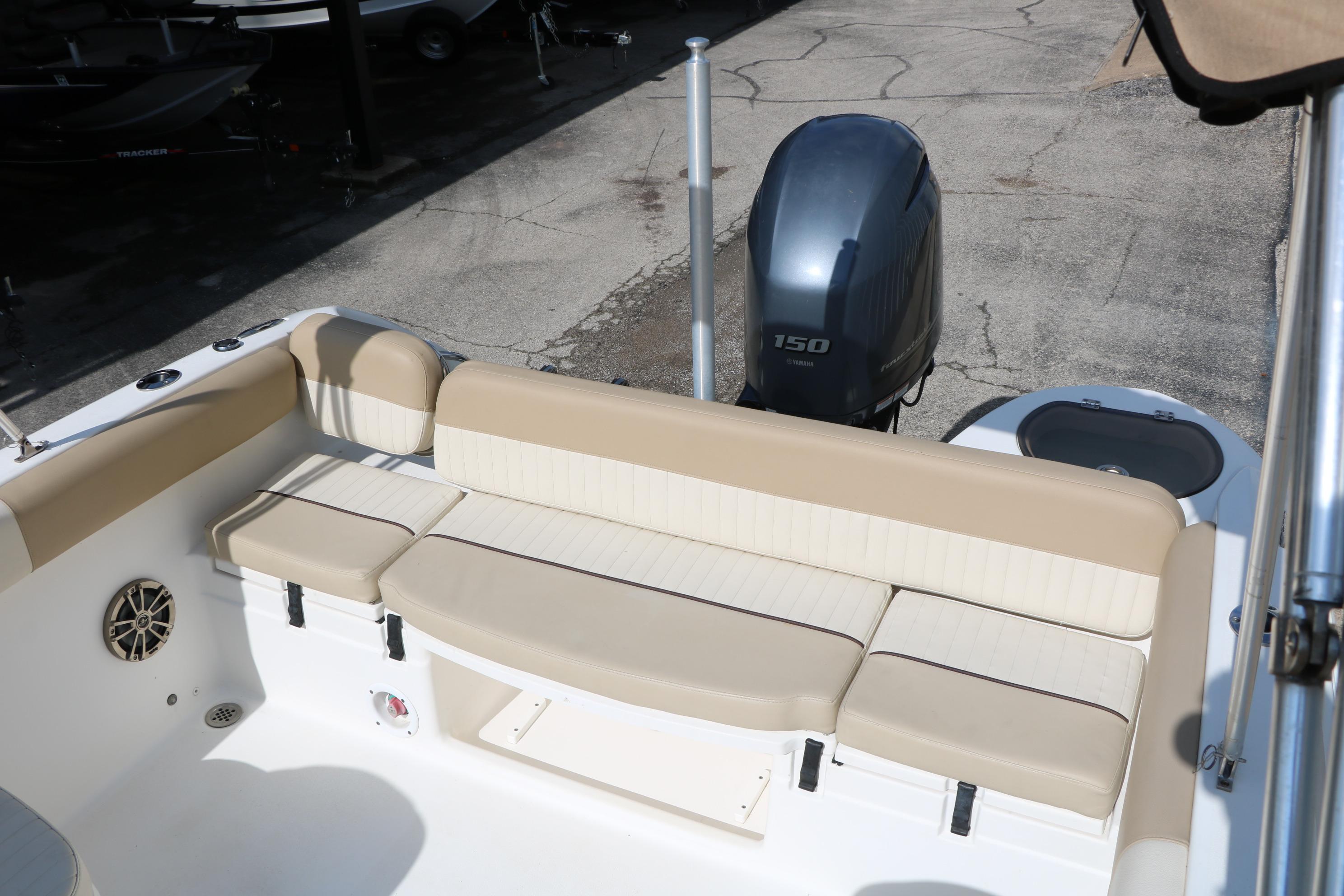 2017 Sea Fox 226 Traveler boat interior with beige seating and Yamaha 150 outboard motor.