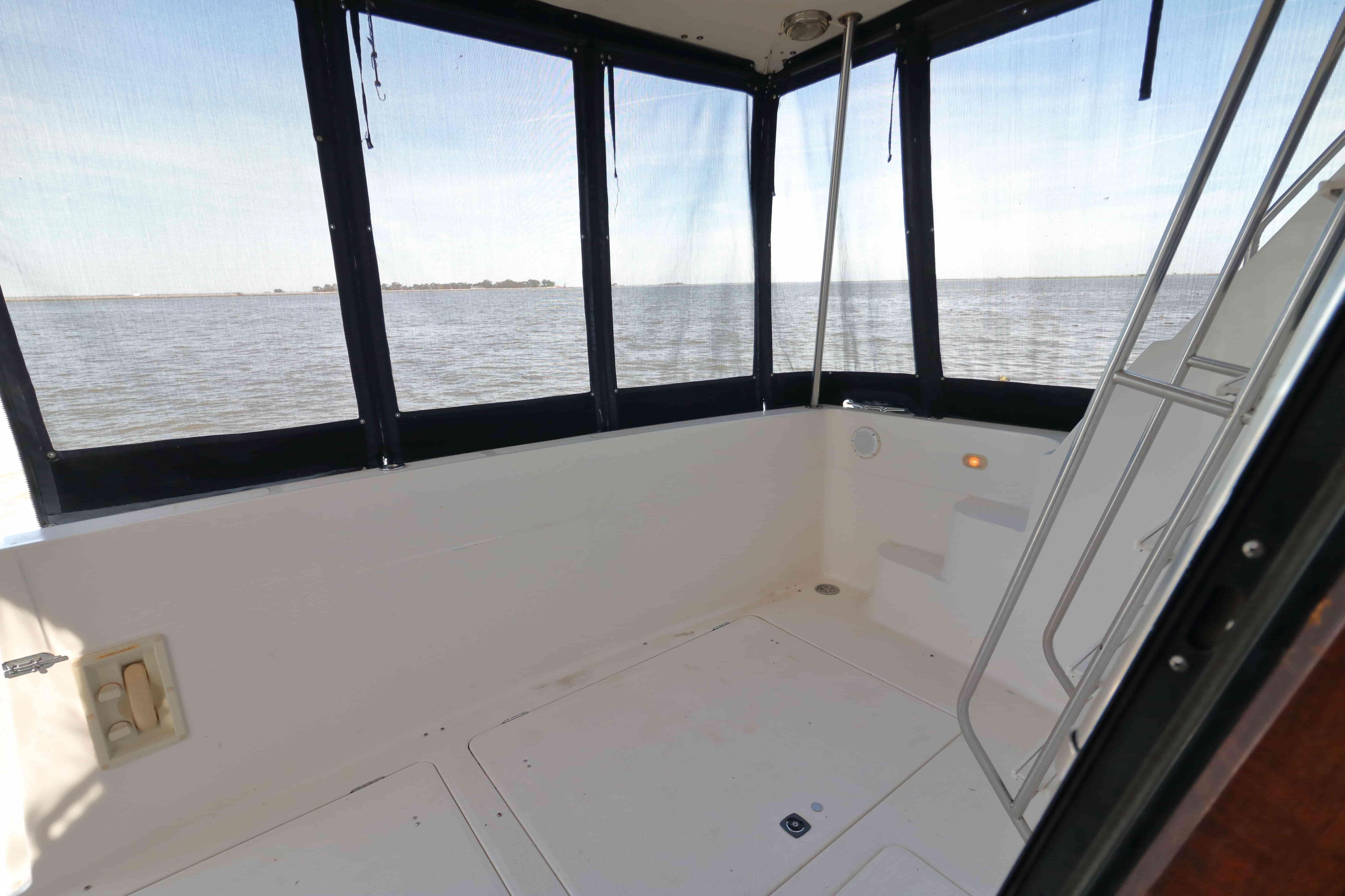 1995 Bayliner 3988 Command Bridge Motoryacht interior with ocean view and ladder.