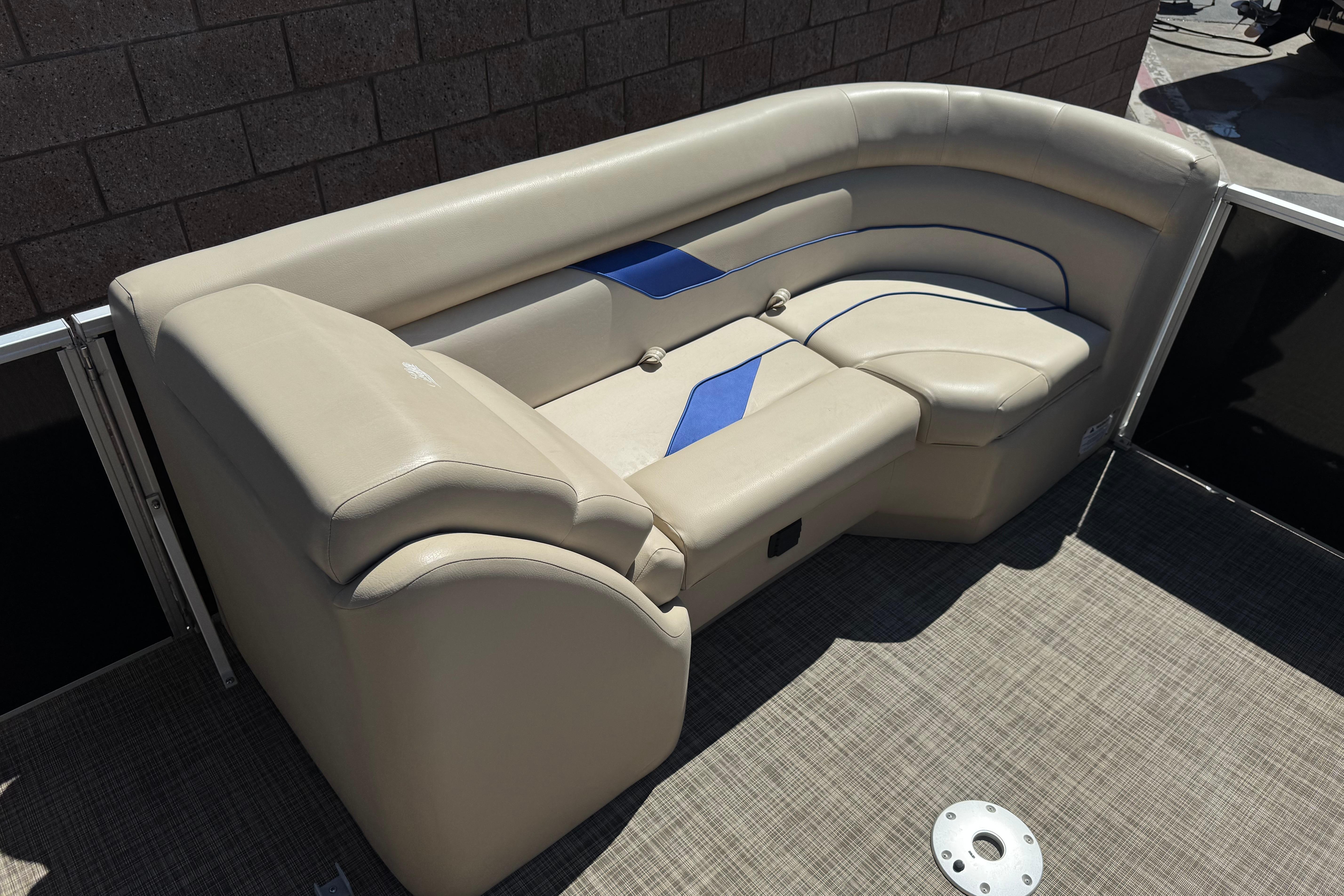2021 SunCatcher Select 20RCX boat seating with beige and blue upholstery.