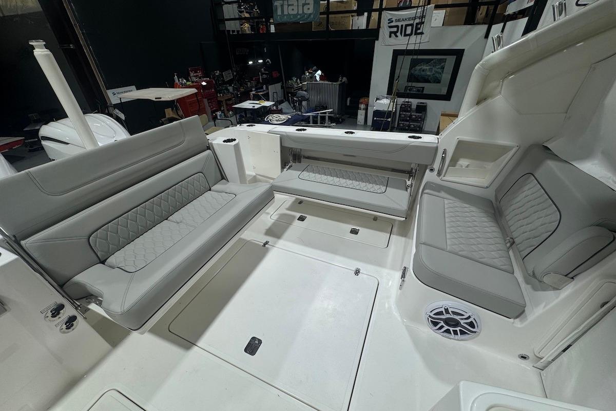 2026 Pursuit DC 326 Dual Console boat interior with gray seating and modern design.