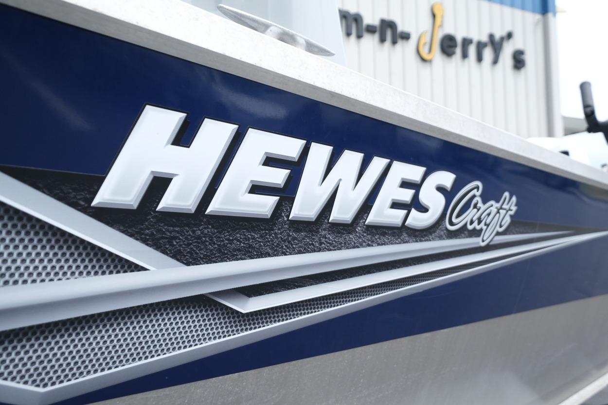 2021 Hewescraft 240 Ocean Pro ET Hardtop boat exterior with logo detail.