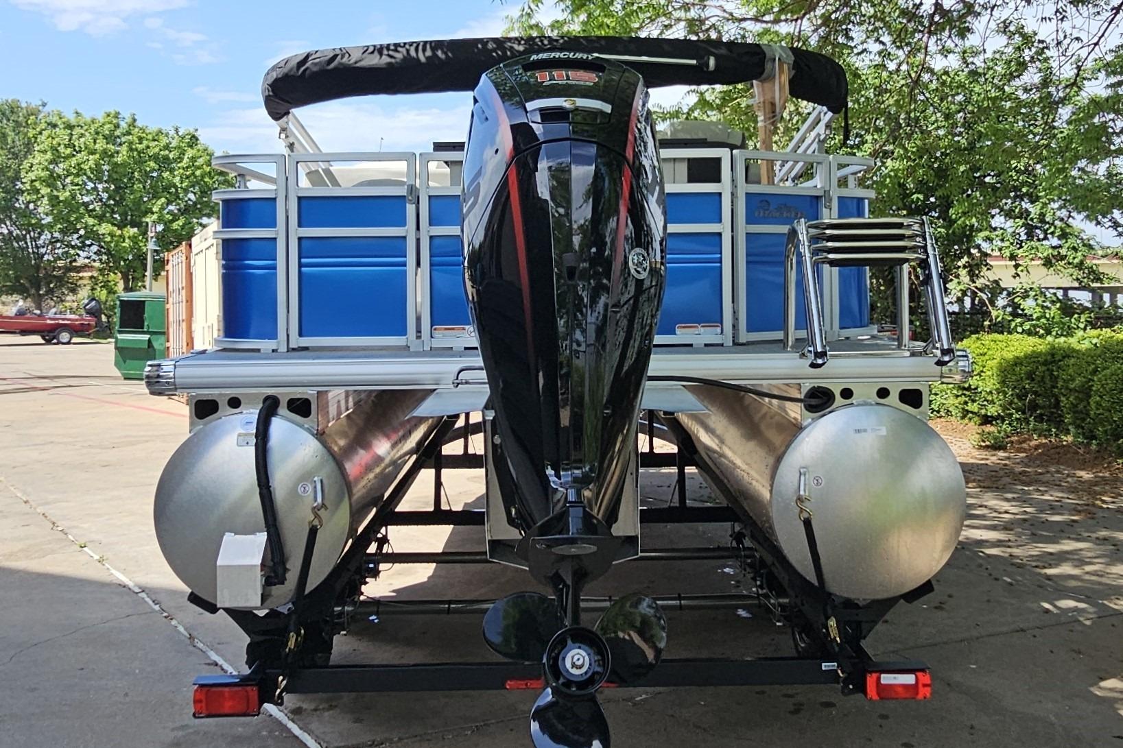 2026 Sun Tracker Fishin' Barge 20 DLX pontoon boat with Mercury outboard motor.