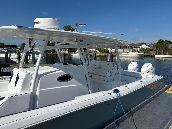 2025 Southport 33 DC boat docked, featuring dual engines and a sleek design.
