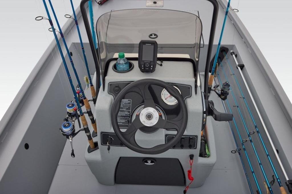 2026 Tracker Bass Tracker Classic CC boat console with fishing rods and navigation equipment.