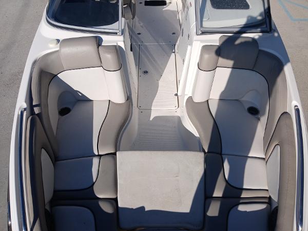 2010 Yamaha Boats 242 Limited interior with gray seating and open deck layout.