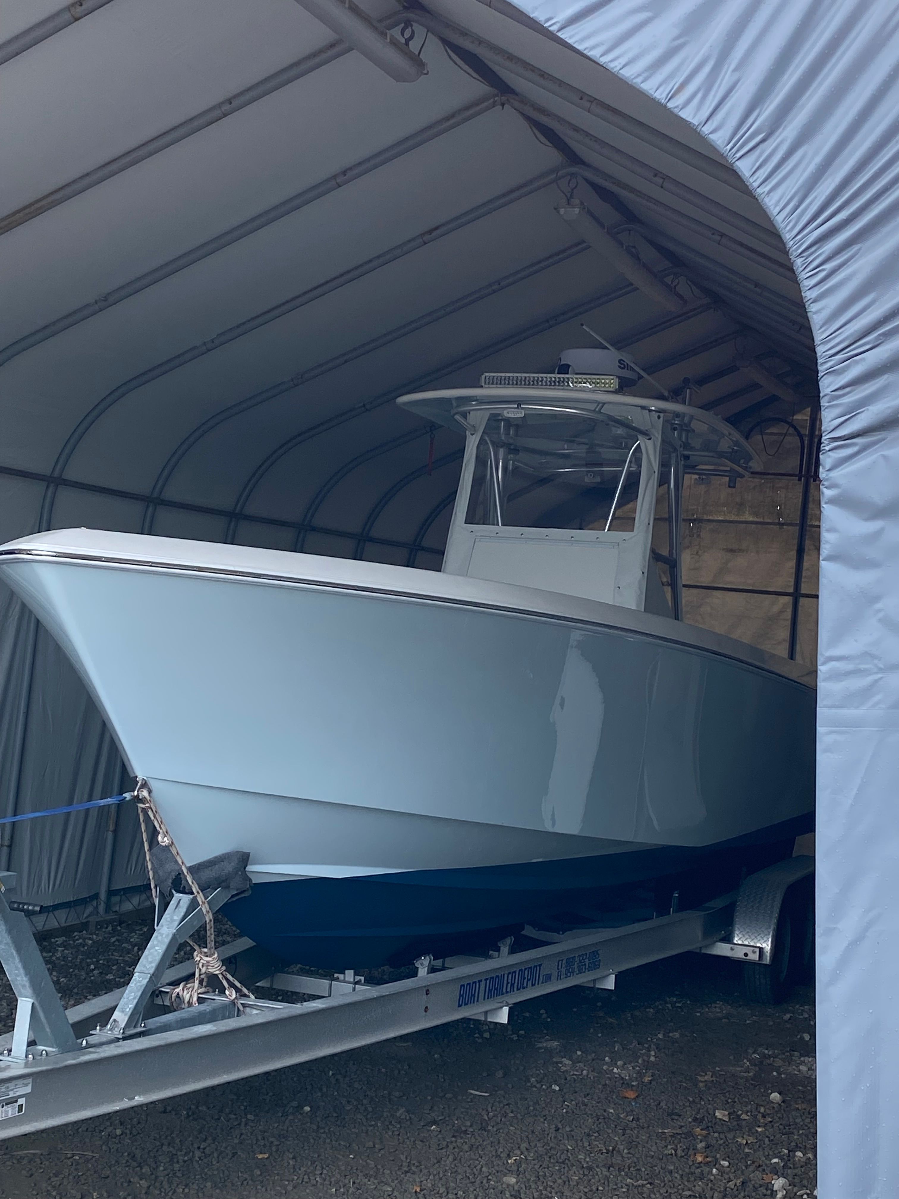 2009 Contender 33 Tournament boat in storage on trailer.
