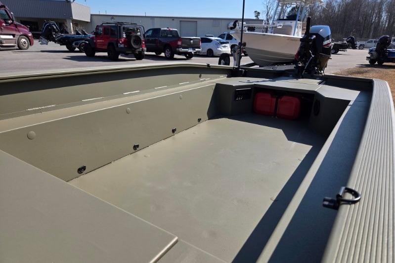 2026 Tracker Grizzly 1650 T Prairie Wings Edition boat, spacious interior, parked outdoors.