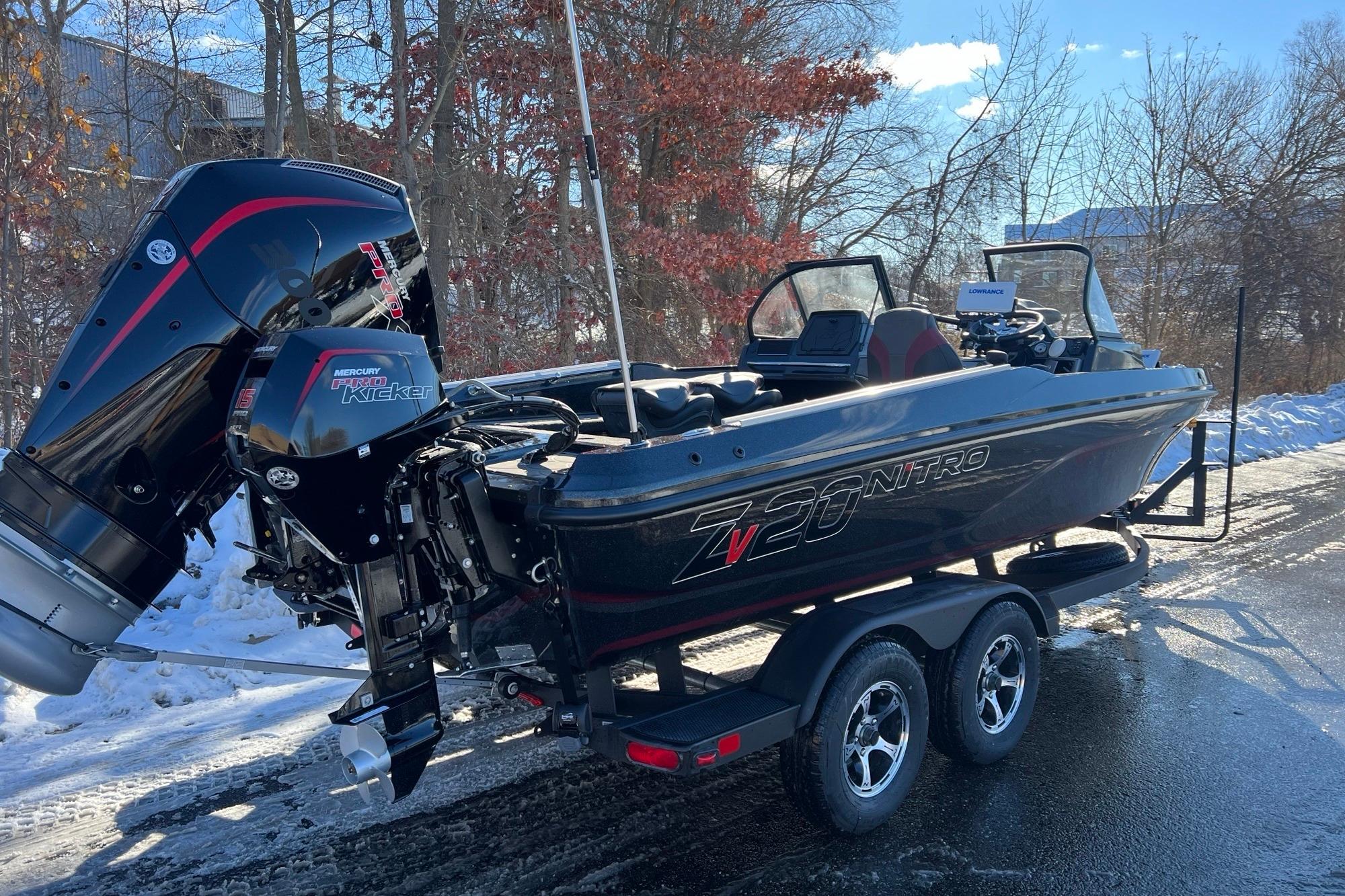 2026 Nitro ZV20 boat with dual Mercury engines on a snowy road.