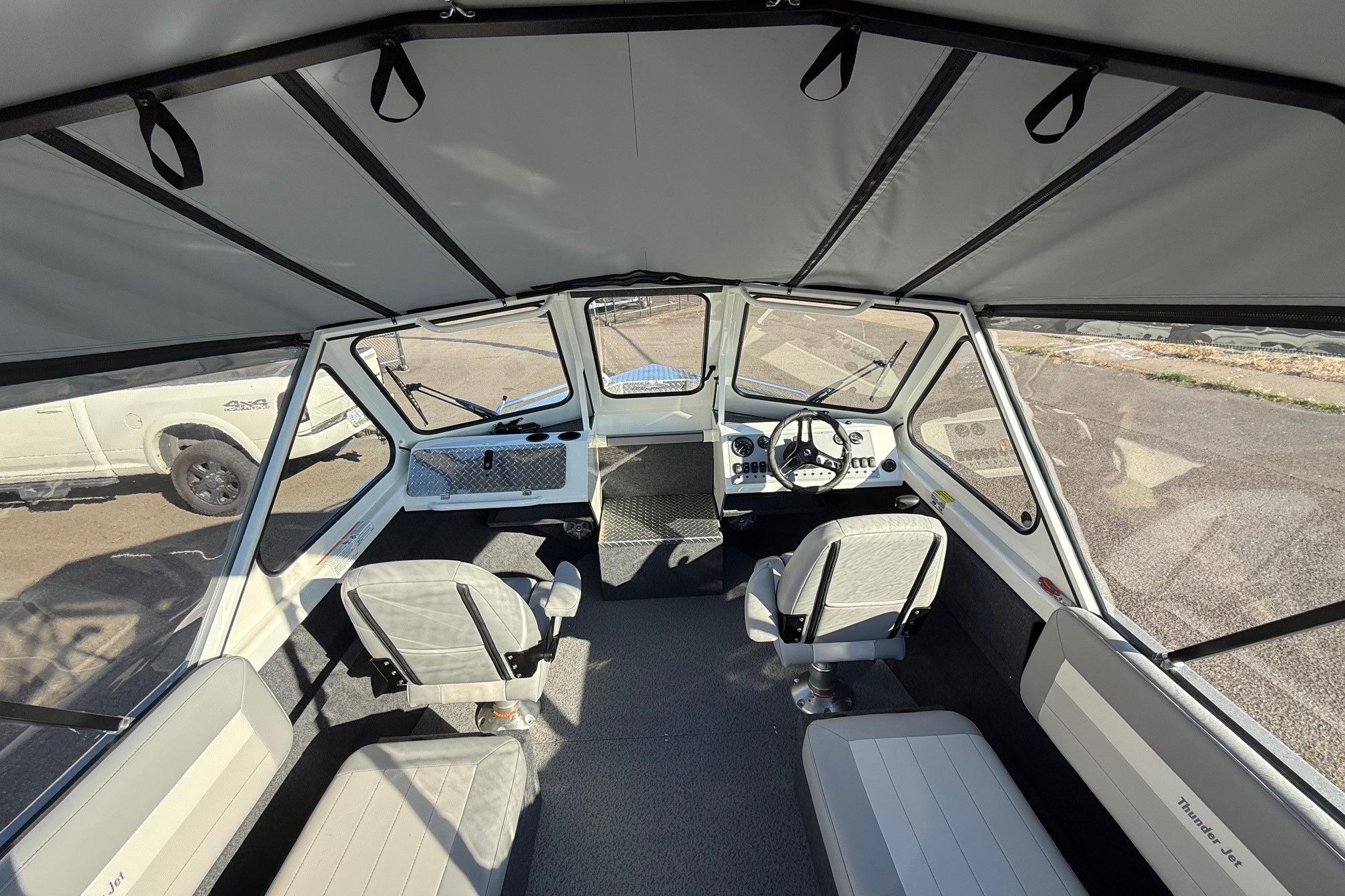 Interior of 2026 Thunder Jet 185 Luxor boat with seating and steering console.