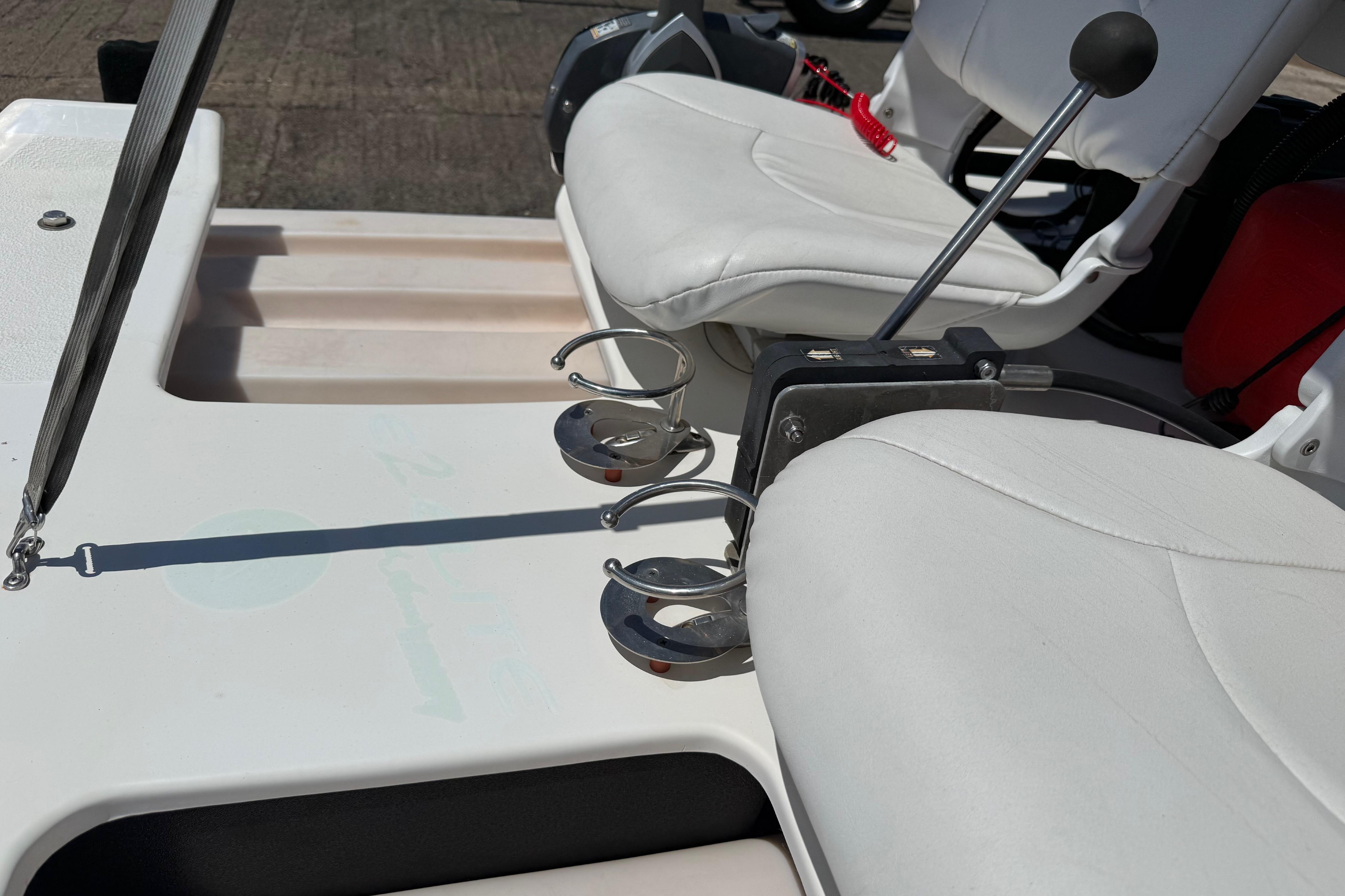 2016 CraigCat E2 Elite boat interior with white seats and cup holders.