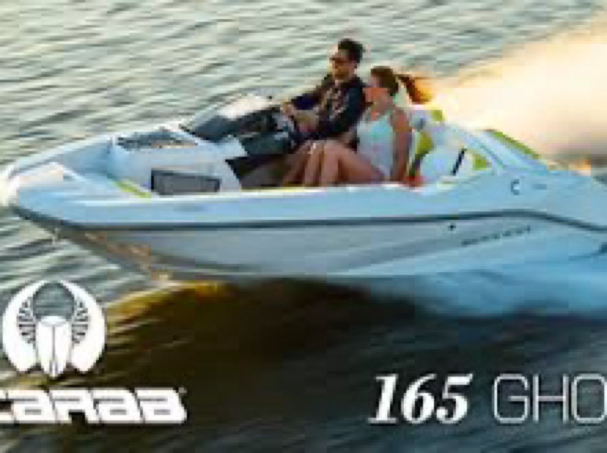 A 2017 Scarab 165 G boat speeding across the water.