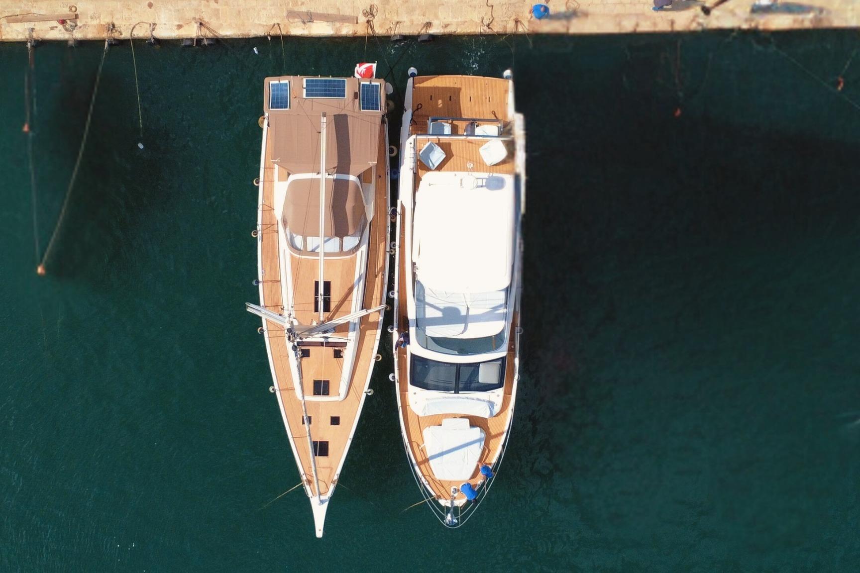 Aerial view of 2017 Grand Soleil 52LC yacht docked beside another boat.