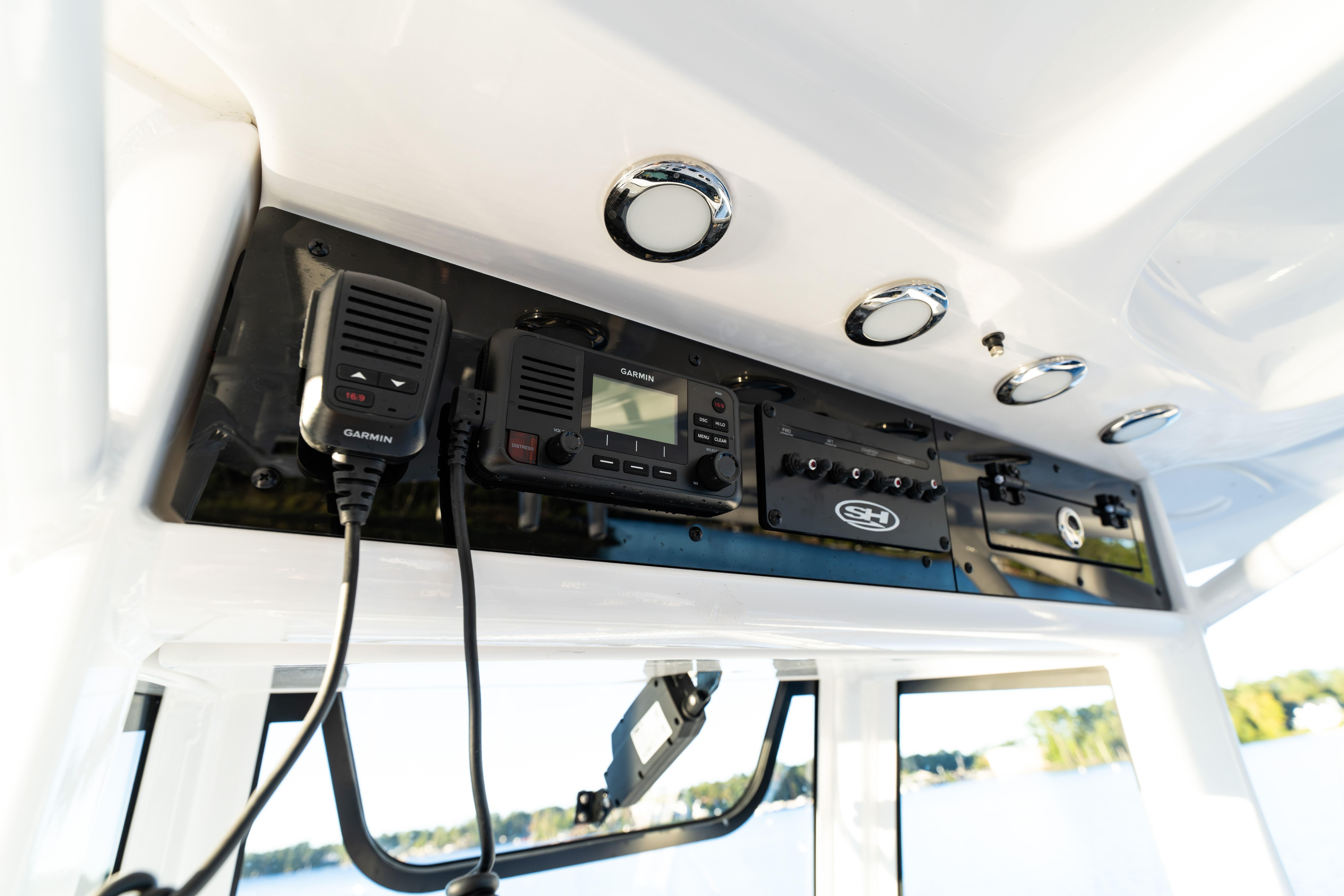 2026 Sea Hunt Ultra 275 Coffin Box boat console with Garmin electronics and controls.