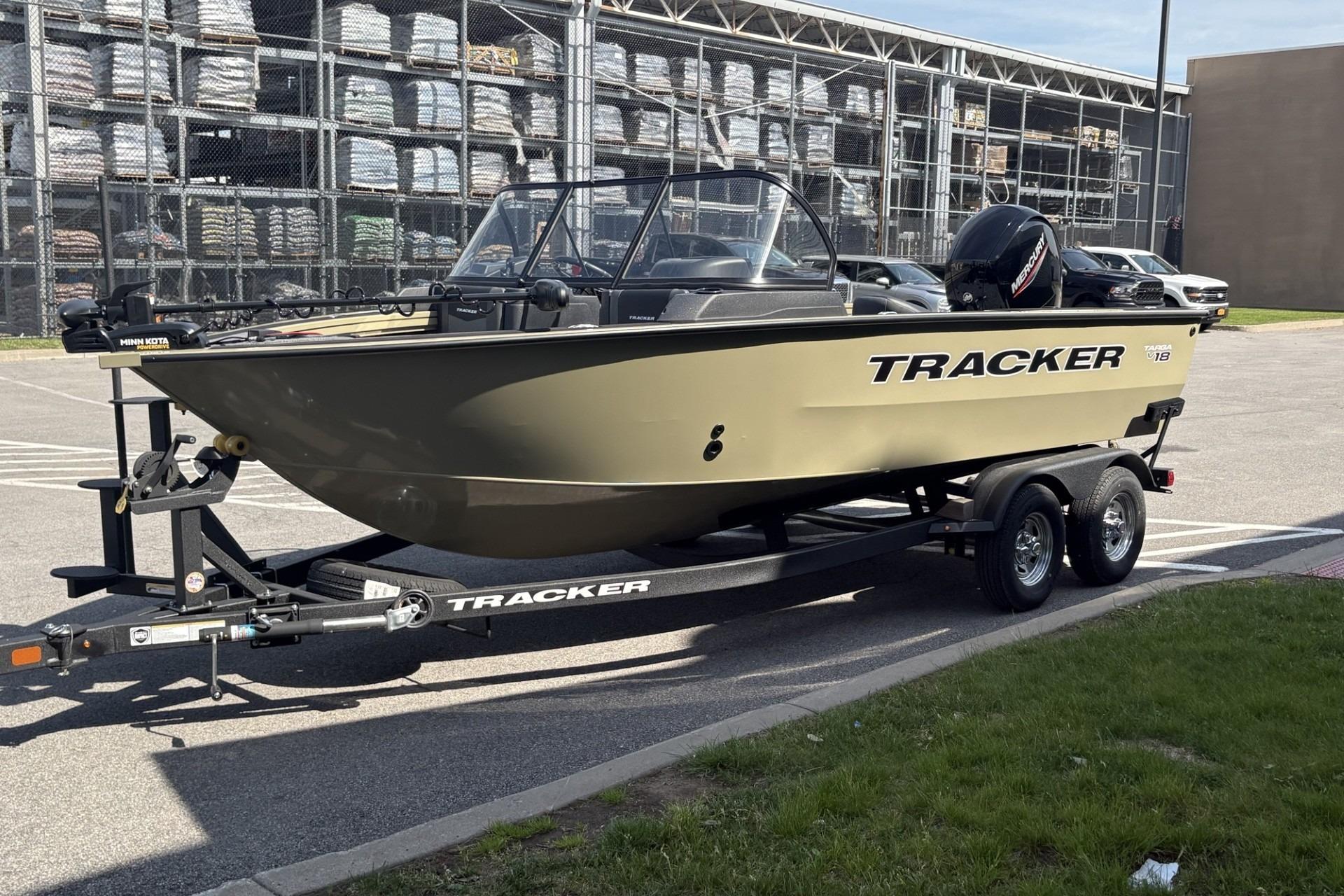 2026 Tracker Targa V-18 Combo boat on trailer in parking lot.