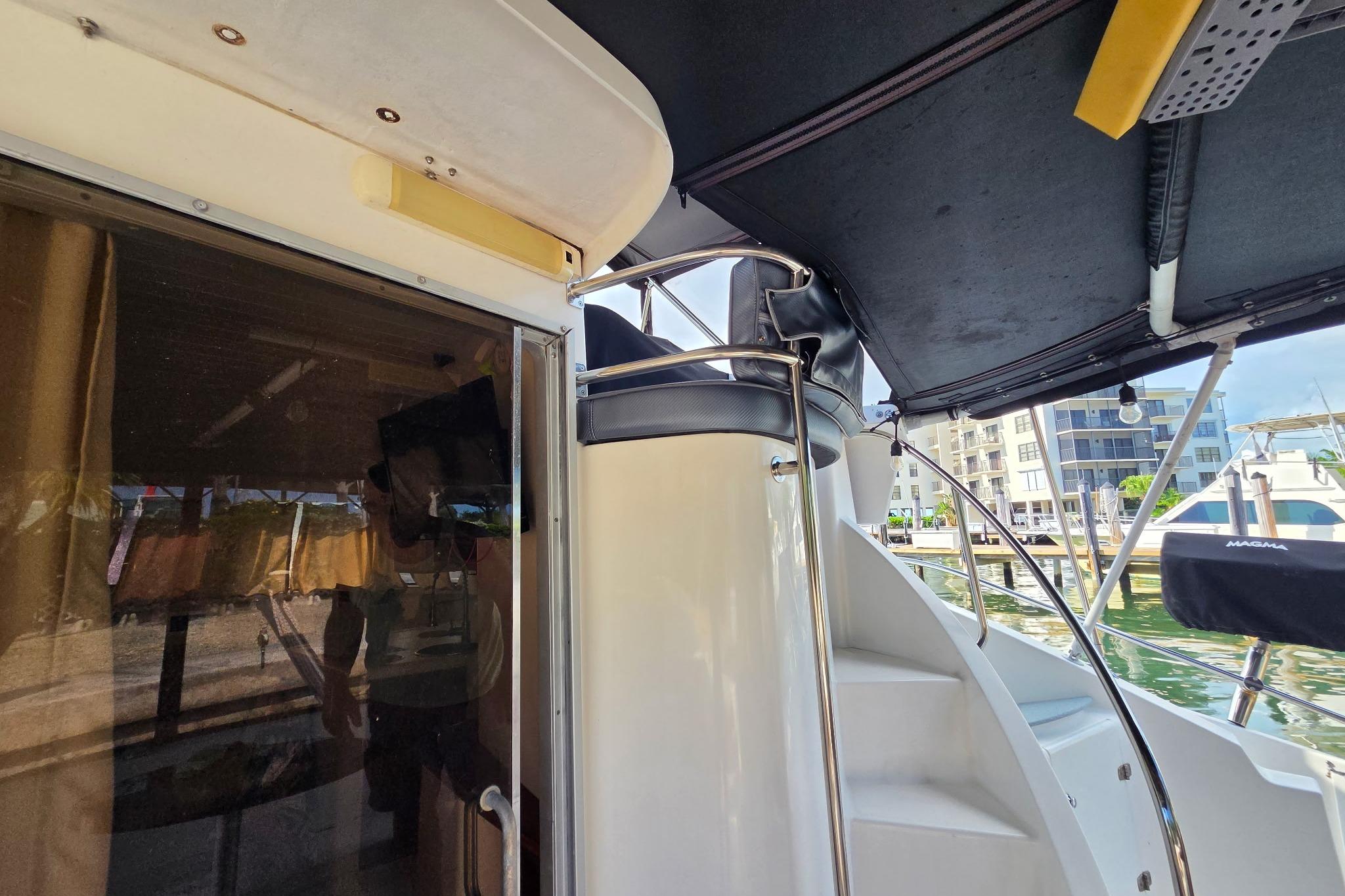 2000 Fountaine Pajot Maryland 37 yacht interior with stairs and marina view.