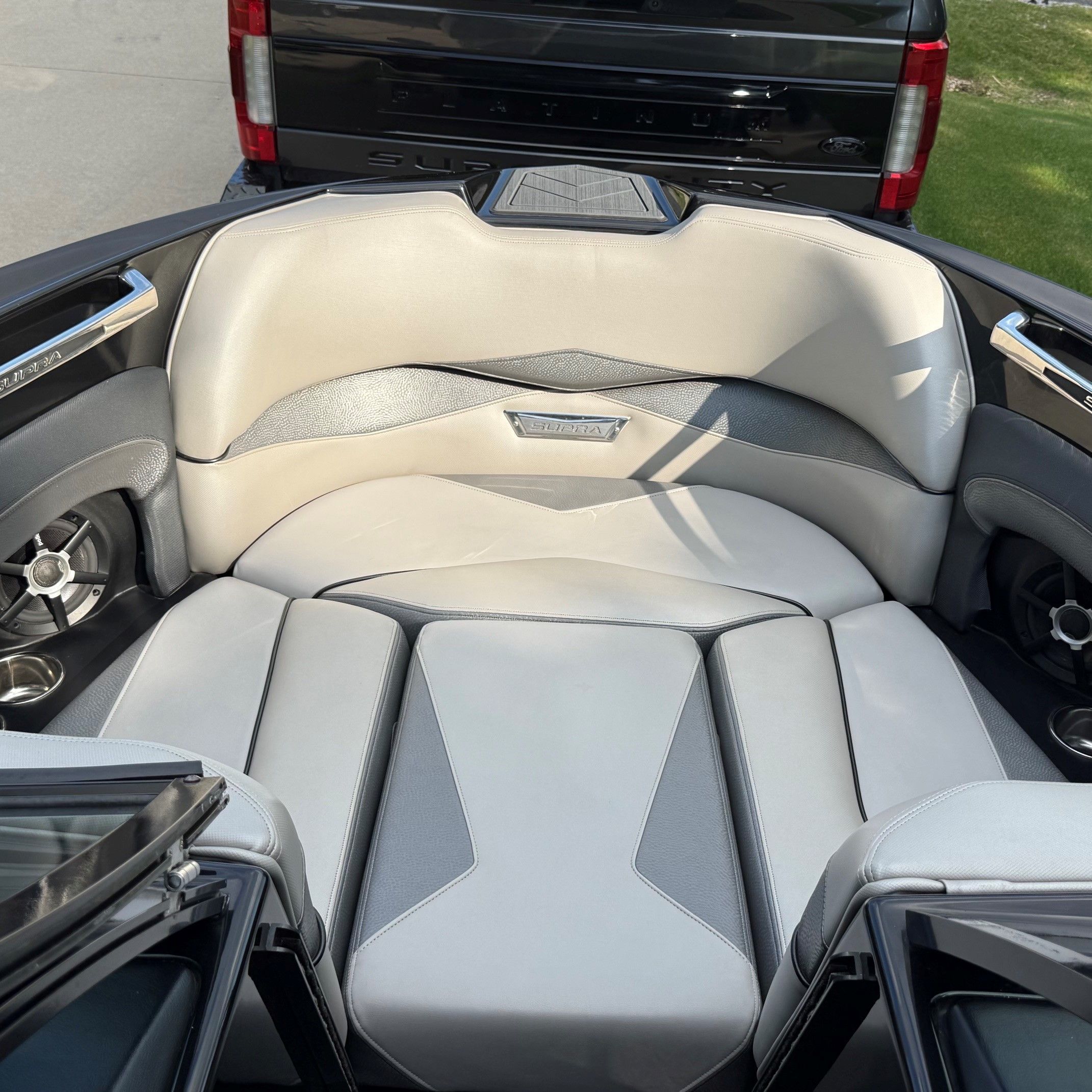 Interior of a 2014 Supra SC350 with gray and white upholstery.