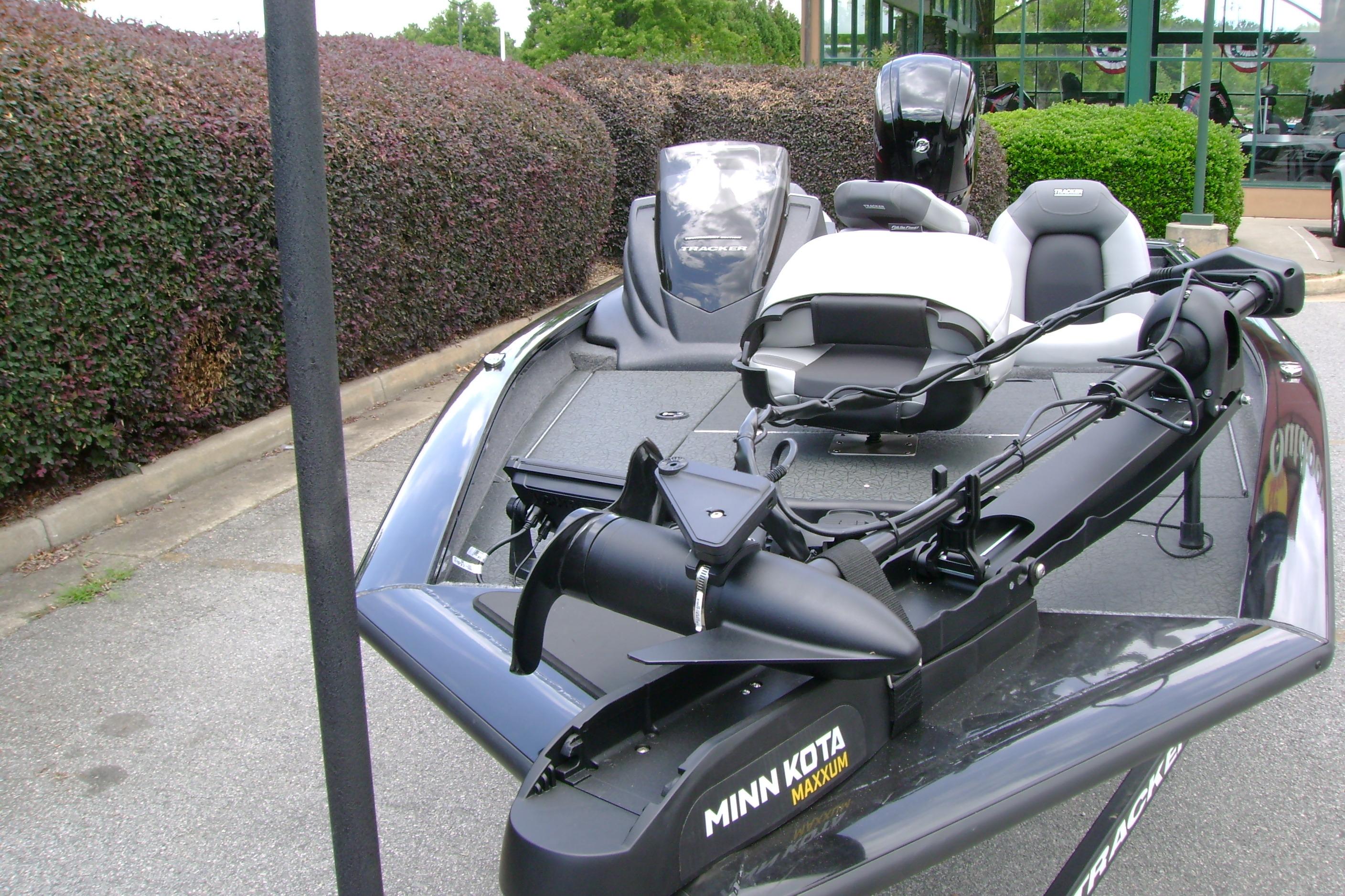 2026 Tracker Pro Team 175 boat with Minn Kota Maxxum trolling motor, parked outdoors.