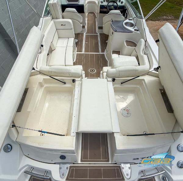 2008 Sea Ray 270 SLX boat interior with white seating and brown flooring.
