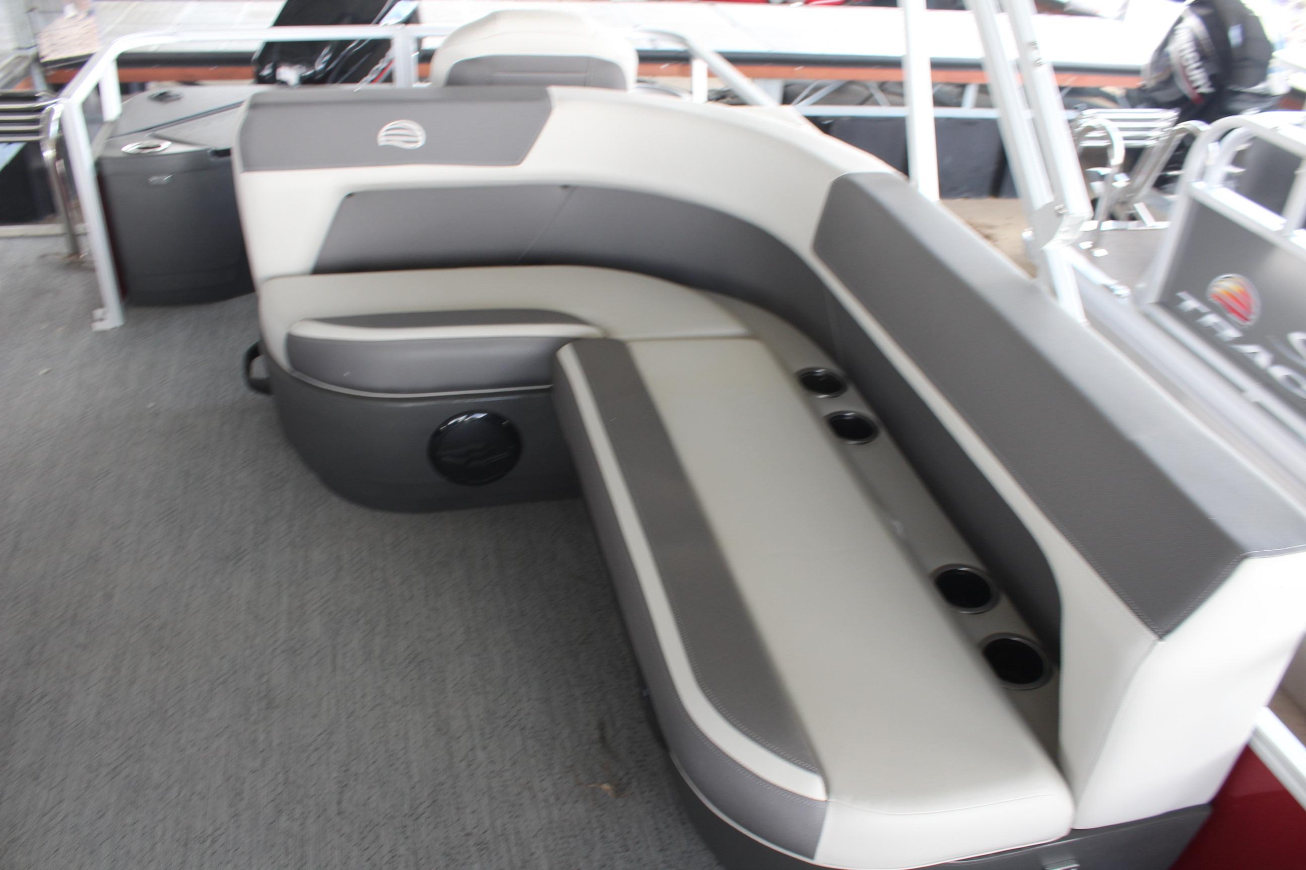 2026 Sun Tracker Bass Buggy 18 DLX interior with gray seating and cup holders.