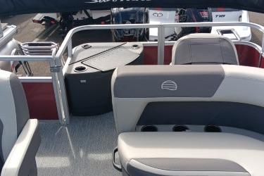 2026 Sun Tracker Bass Buggy 18 DLX pontoon boat interior with seating and table.