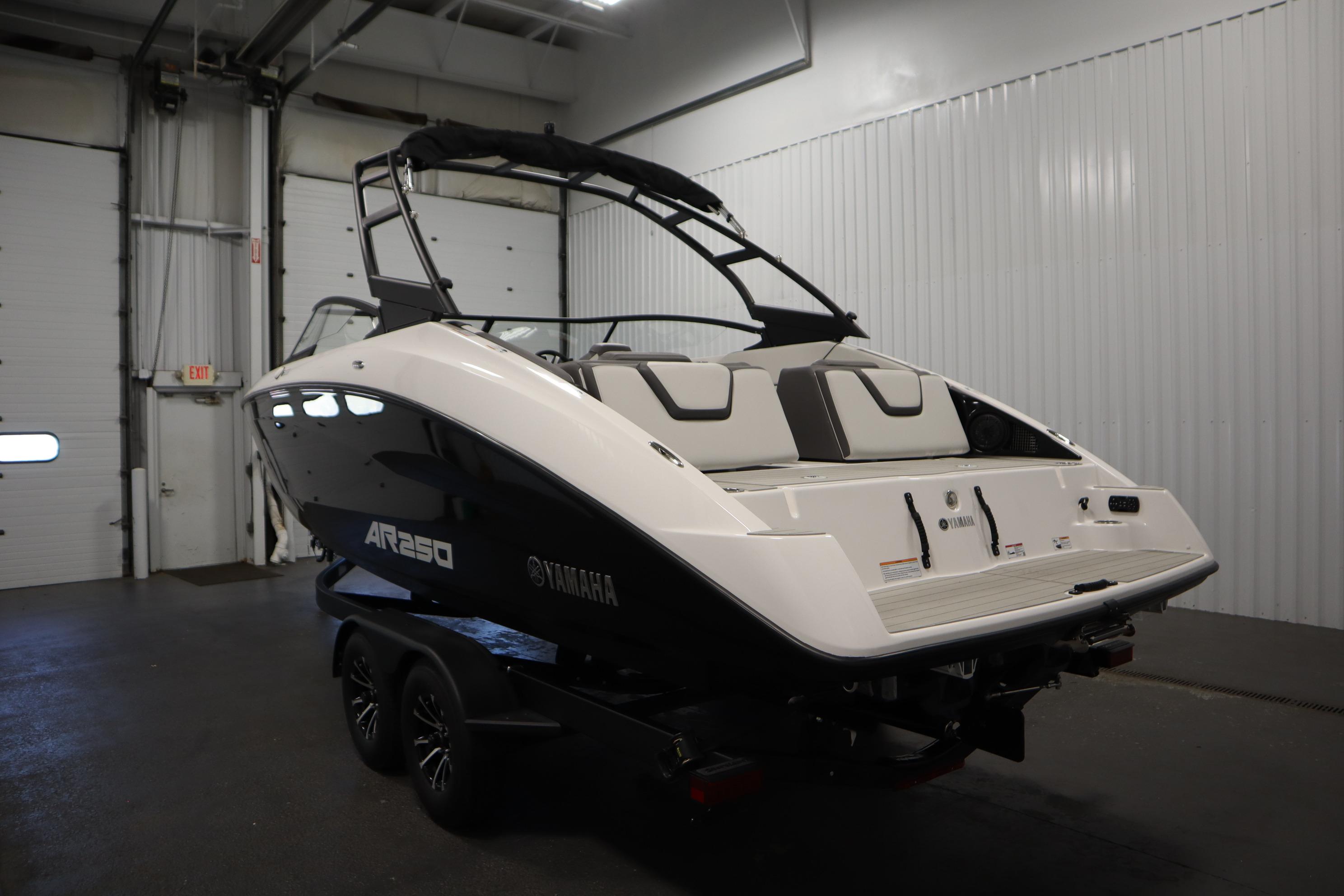 2026 Yamaha AR250 boat in a garage, showcasing sleek design and modern features.