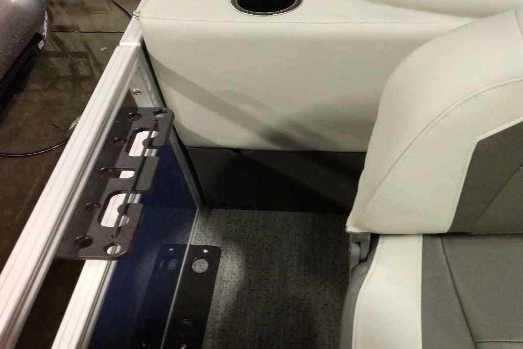 Interior of 2026 Sun Tracker Bass Buggy 18 DLX with seating and cup holder.