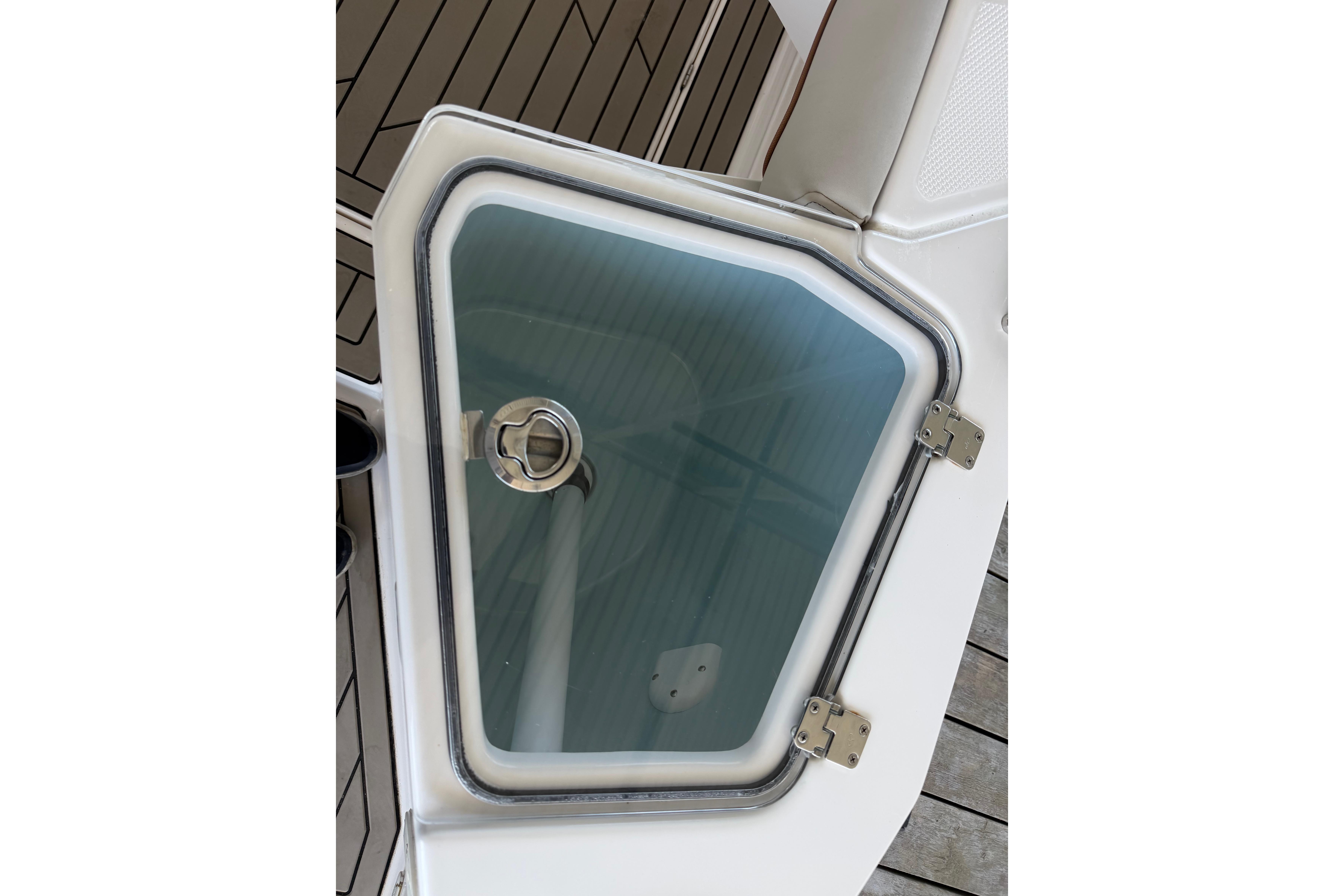 2023 Cutwater C-288 Coupe boat hatch with secure latch and sleek design.