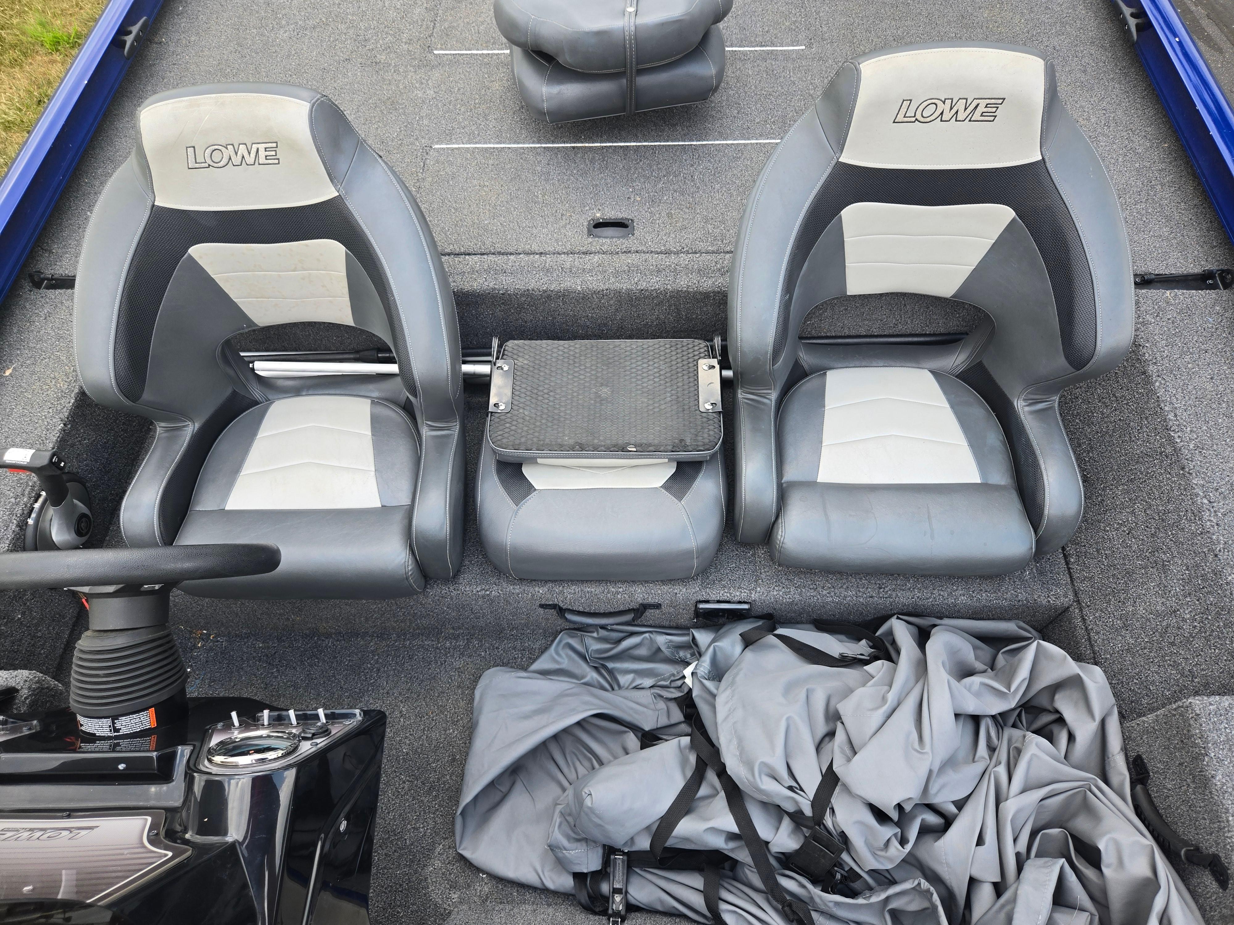2021 Lowe Stinger 188 boat interior with gray seats and steering console.