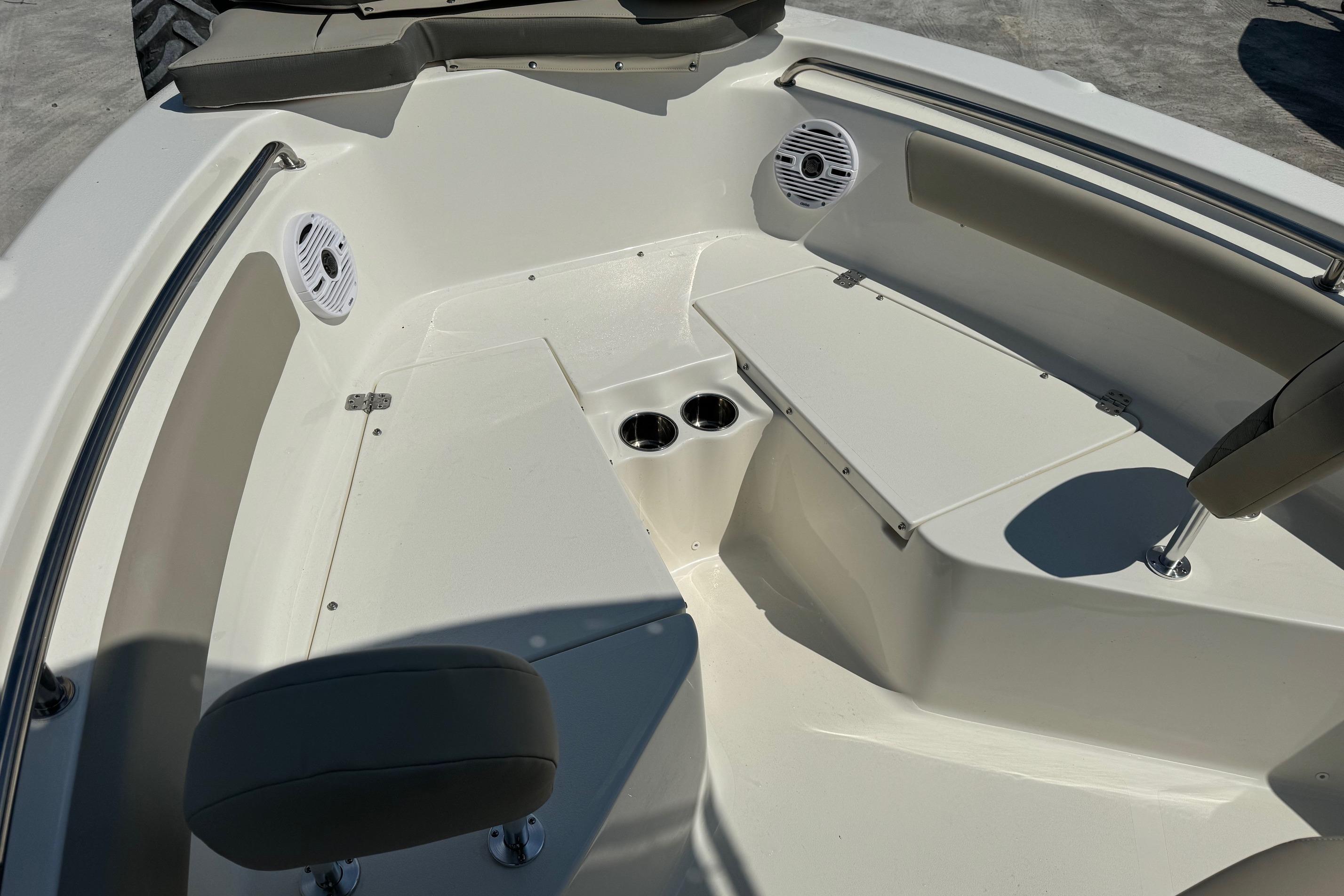 2025 Key West 203 FS boat interior with seating, cup holders, and speakers.