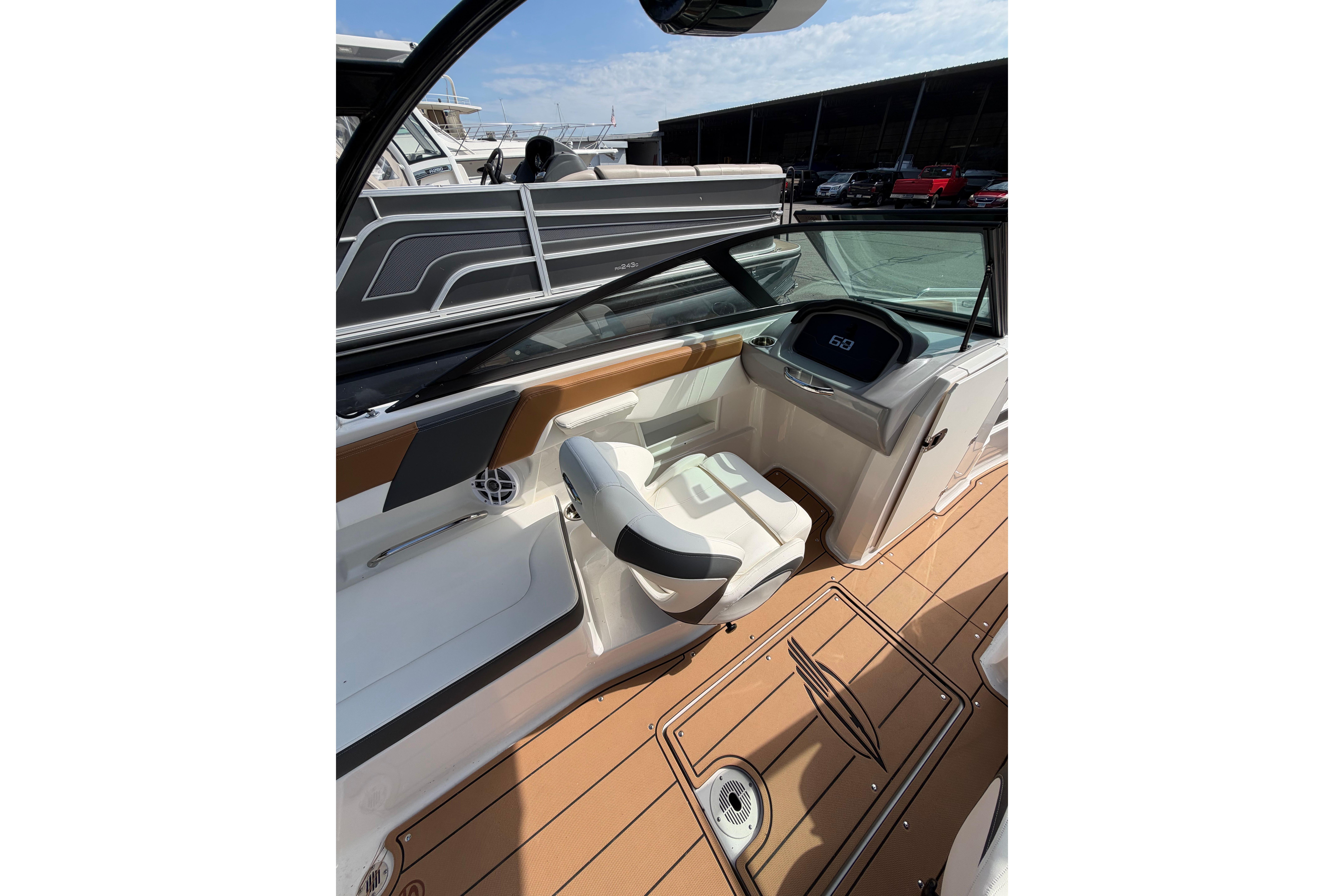 Interior of 2025 Chaparral 230 SSi boat with modern dashboard and seating.