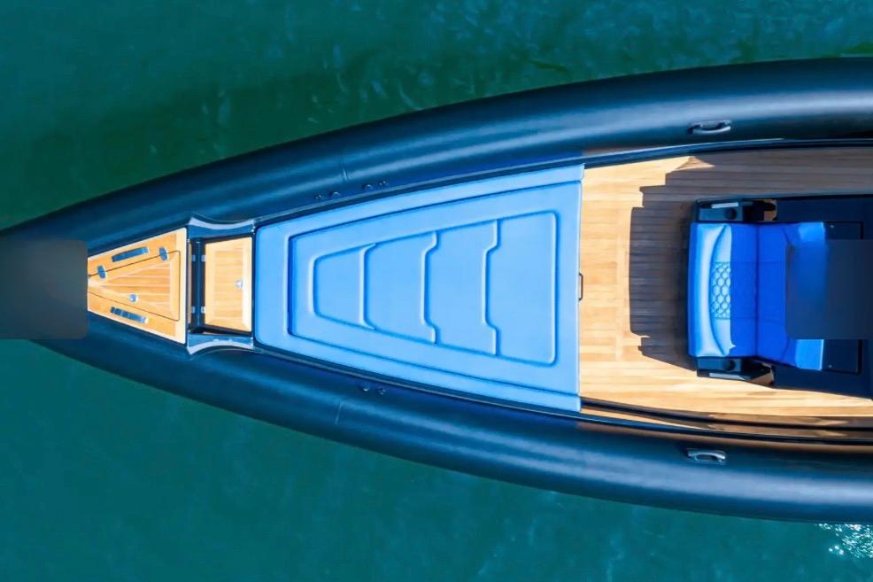 Aerial view of 2025 Technohull 38 Gran yacht with sleek design and blue accents.